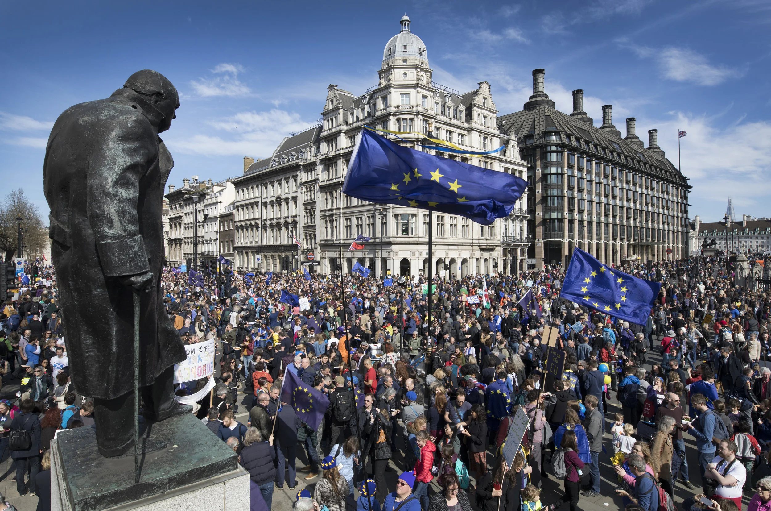 Winston Churchill's statue looks down on protesters  during the Unite for Europe march in Parliament Square on March 25, 2017.