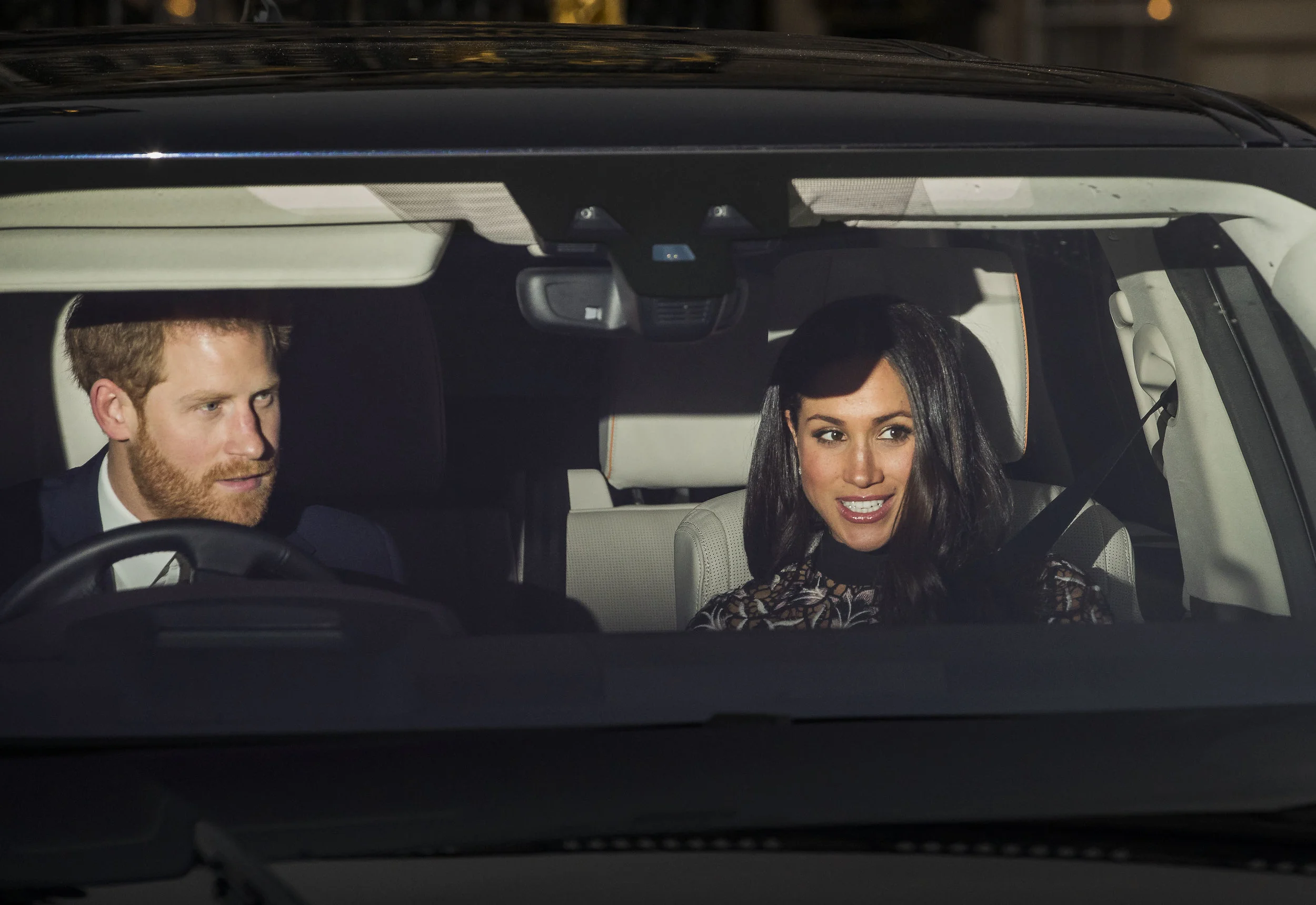 Prince Harry drives Meghan Markle from Buckingham Palace after attending the Queen's Christmas Party on December 20, 2017.