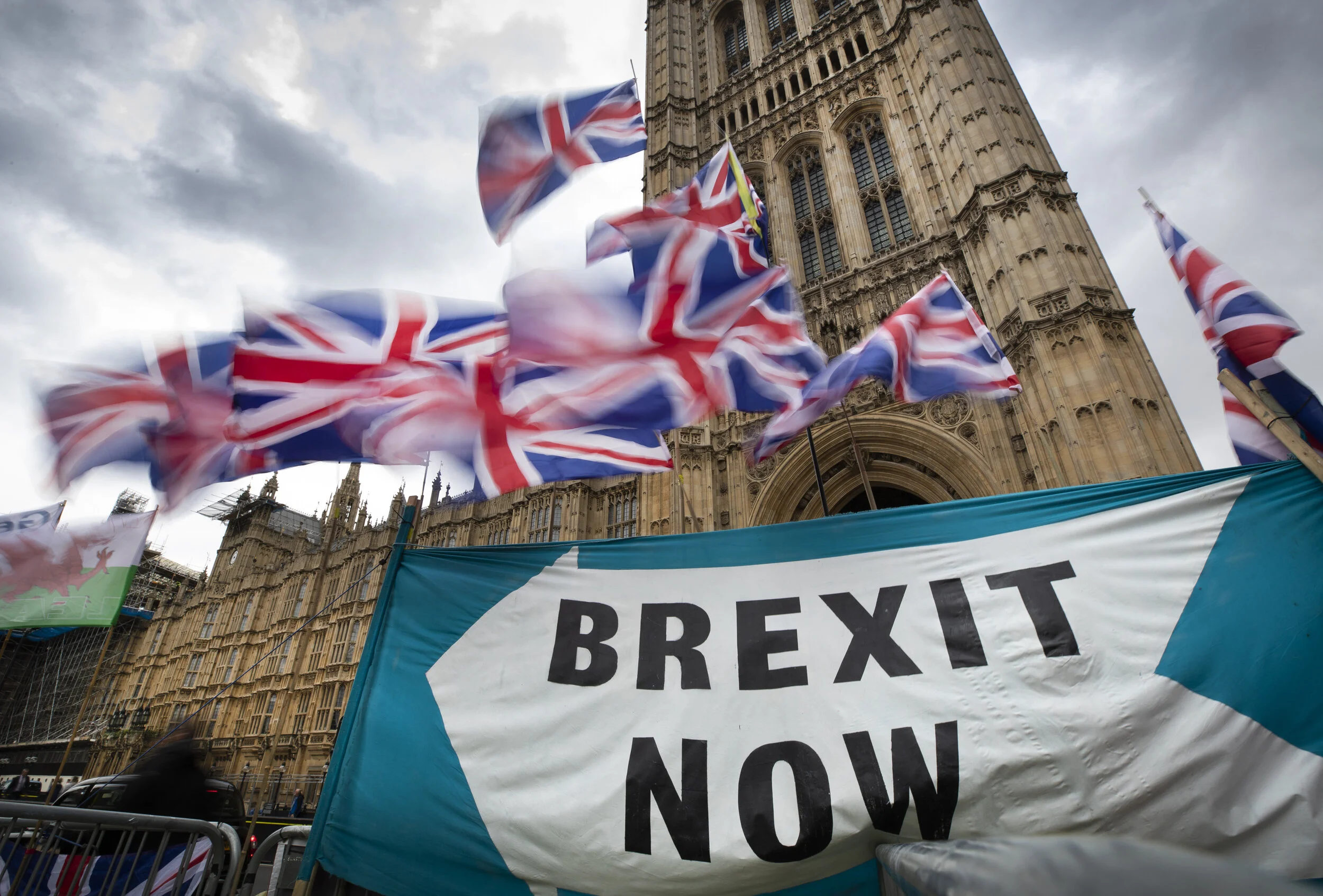 Union flags flutter above a 'BREXIT NOW' banner outside Parliament. September 30, 2019.