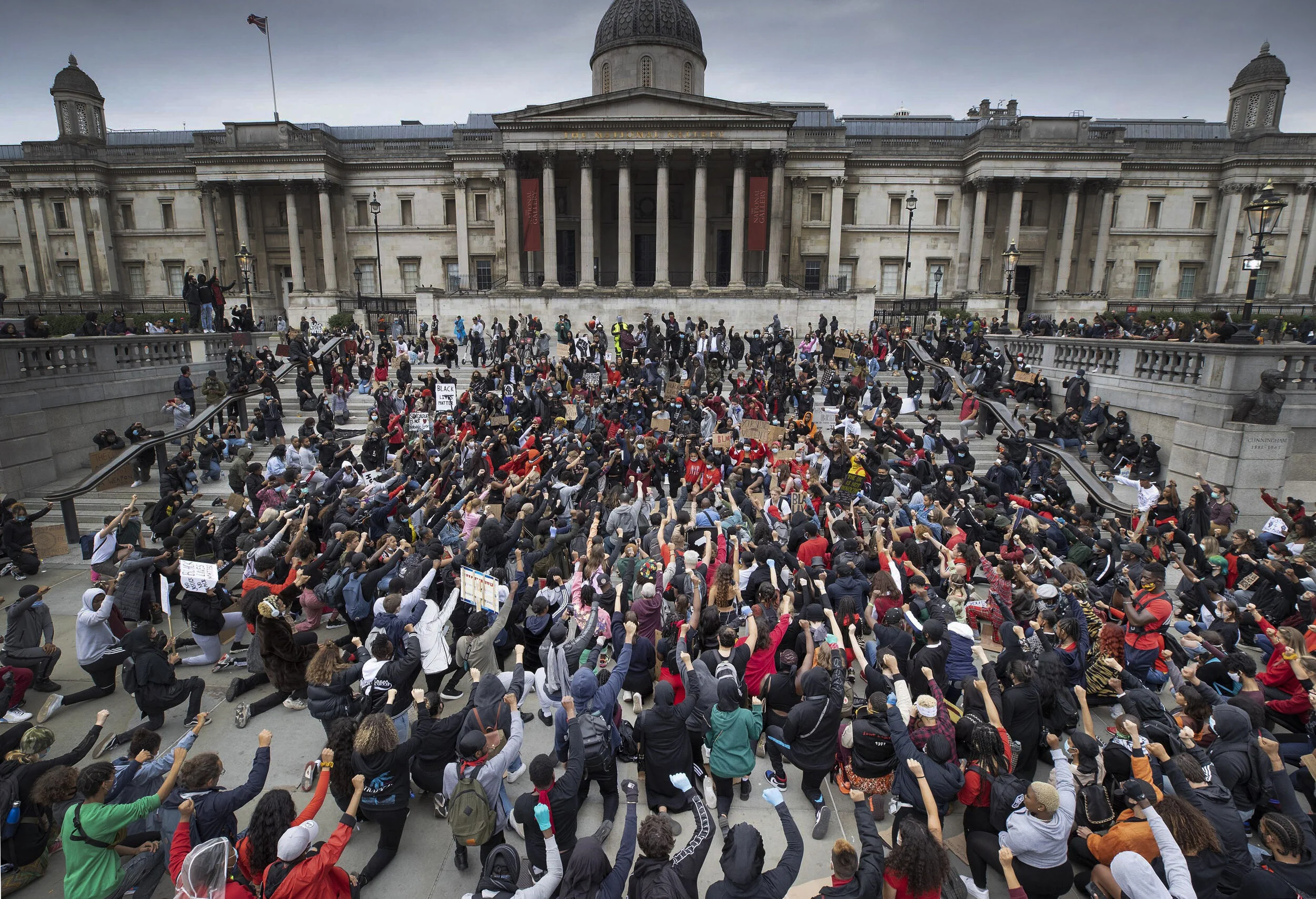 Hundreds of Black Lives Matters protesters 'take the knee' outside the National Gallery in Trafalgar Square during a demonstration following the death of African American George Floyd on June 3, 2020.