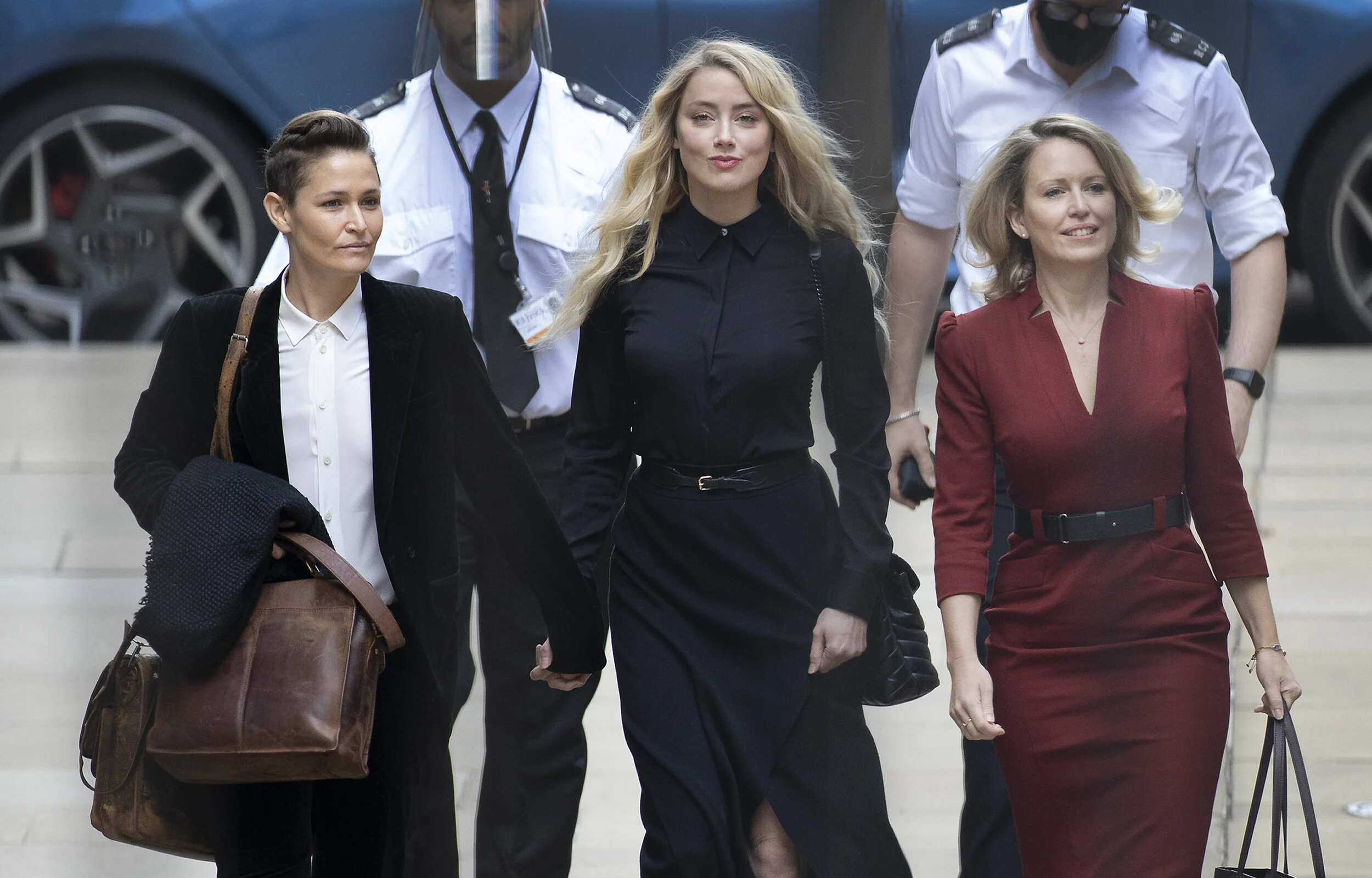 American actor Amber Heard arrives with Bianca Butti (L)  and lawyer Jennifer Robinson  at the High Court in London, where Johnny Depp is in a legal dispute with UK newspaper on July 28, 2020.