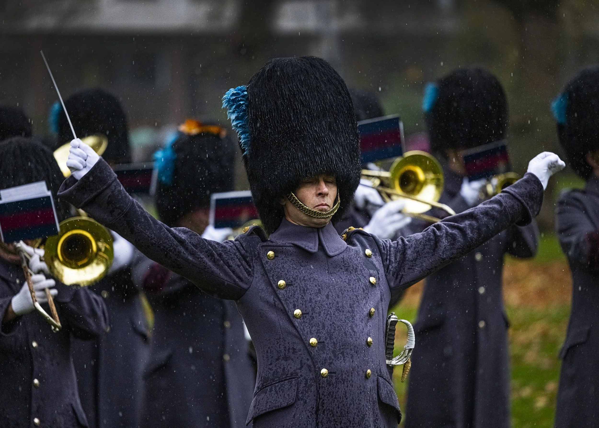 The Band of The Irish Guards appear in heavy rain during a gun salute for the 75th birthday of King Charles III in Green Park, central London on November 14, 2023.