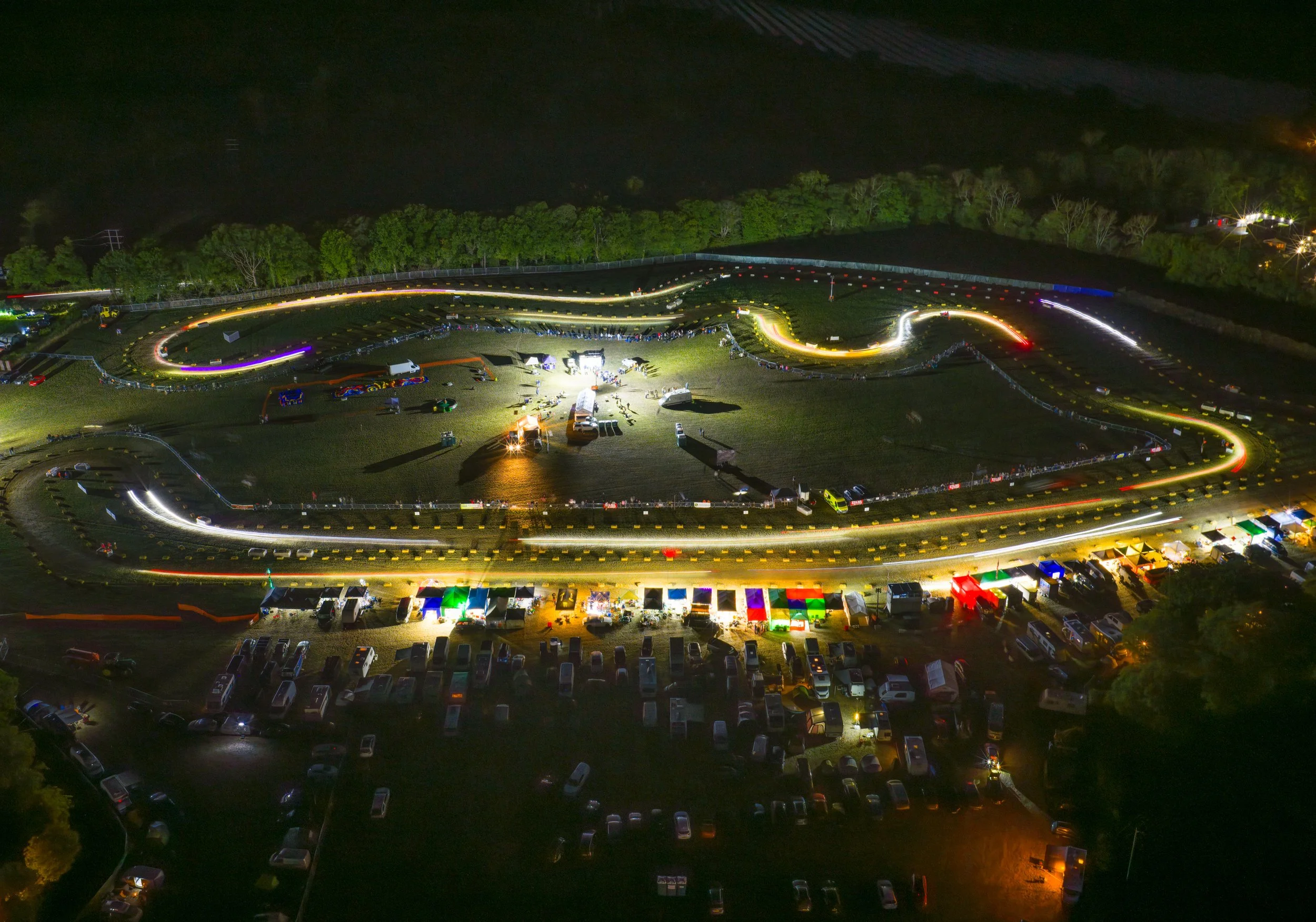 In this long exposure image, lights from the headlights of racing lawn mowers leave a trace during a 12 hour Lawn Mower Endurance Race in West Sussex on August 16, 2025.