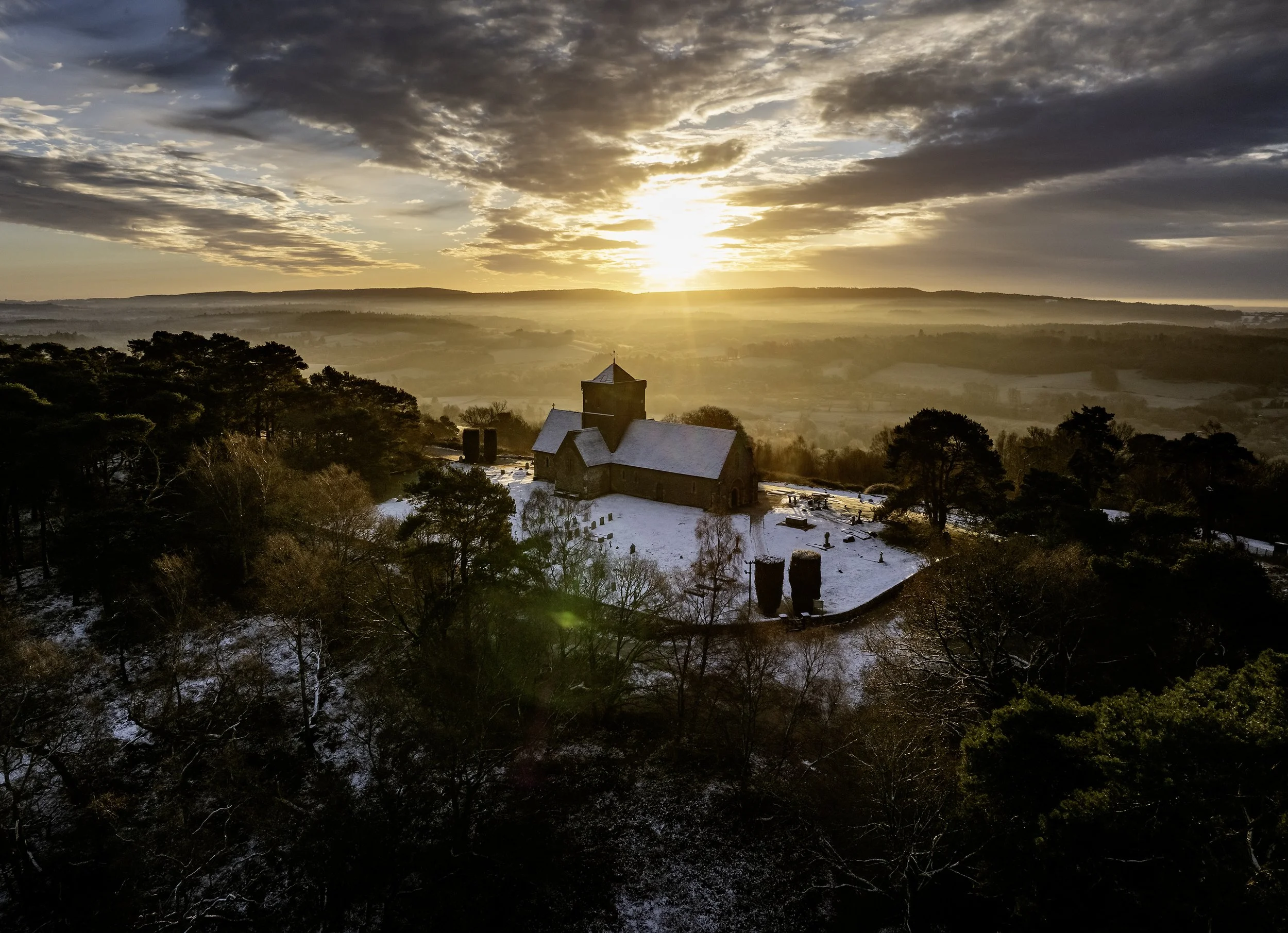 The sun rises over St Martha's Church in sub-zero temperatures near Chilworth, Surrey on January  10, 2025.