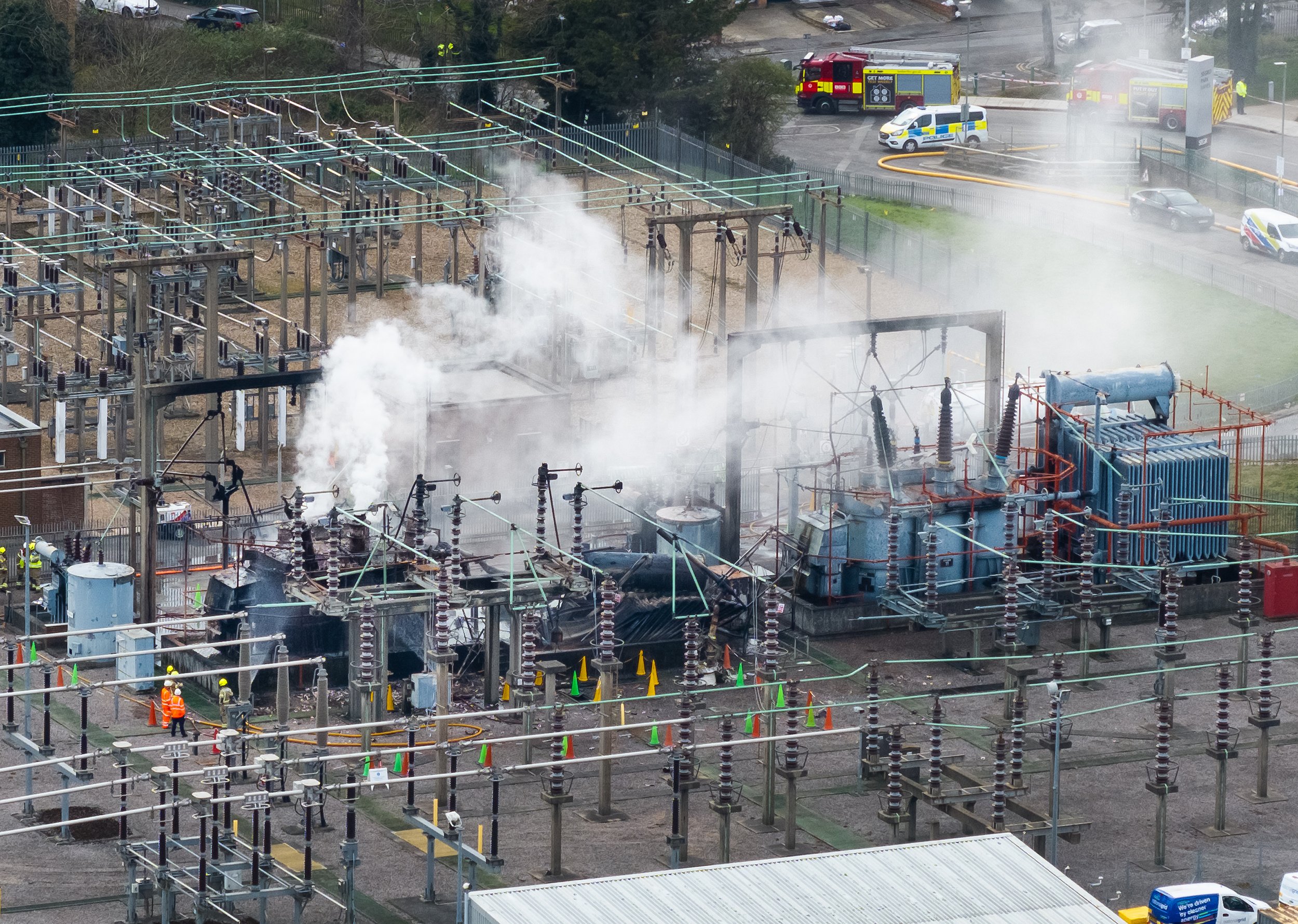 Smoke billows from an electrical substation after a fire which caused the closure of Heathrow  Airport with 1,351 flights affected on March 22, 2025.