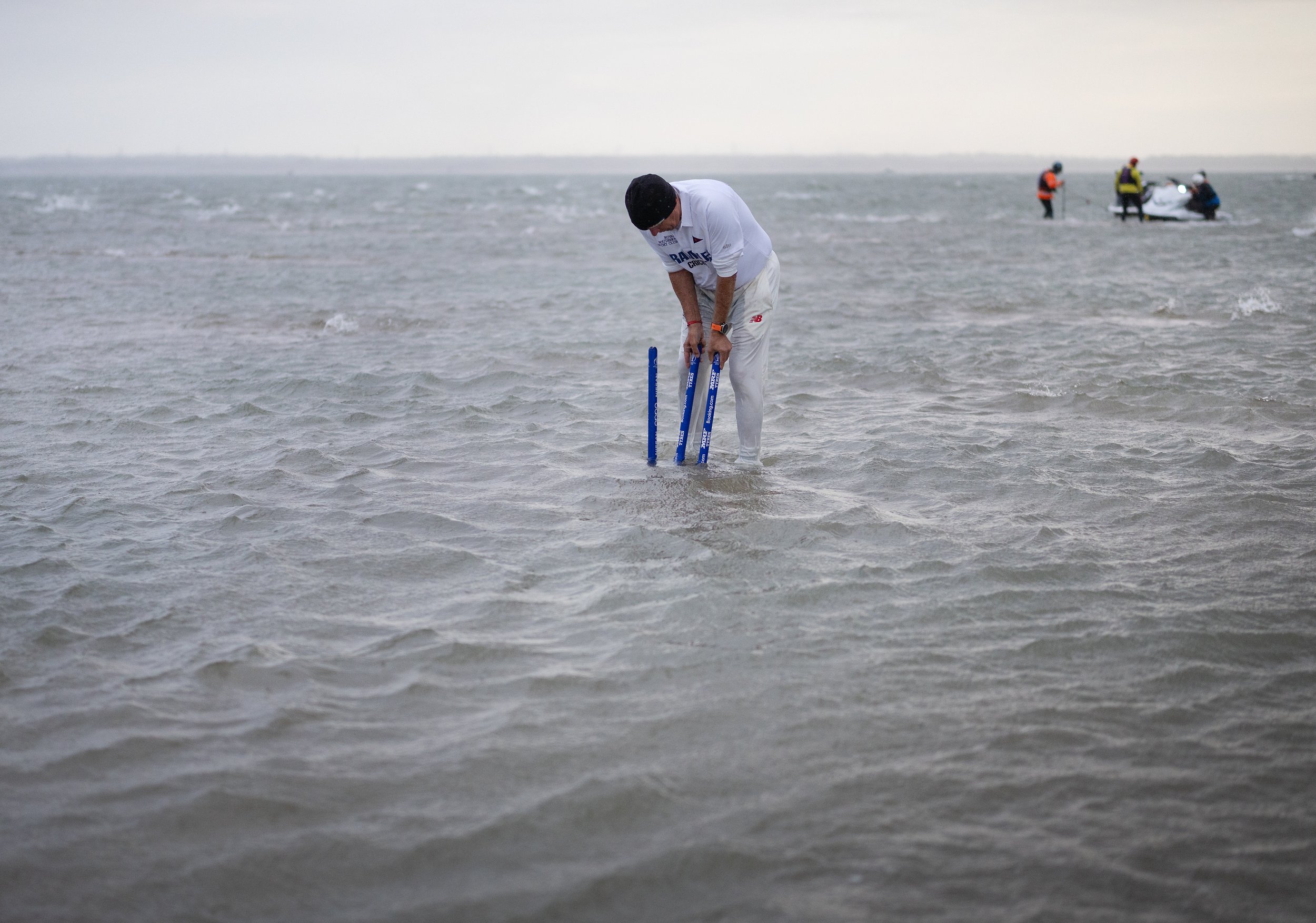 Stumps are placed during the annual Bramble Bank cricket match held between two yacht clubs on a sandbank in the middle of The Solent in Hampshire at low tide on September 11, 2025.