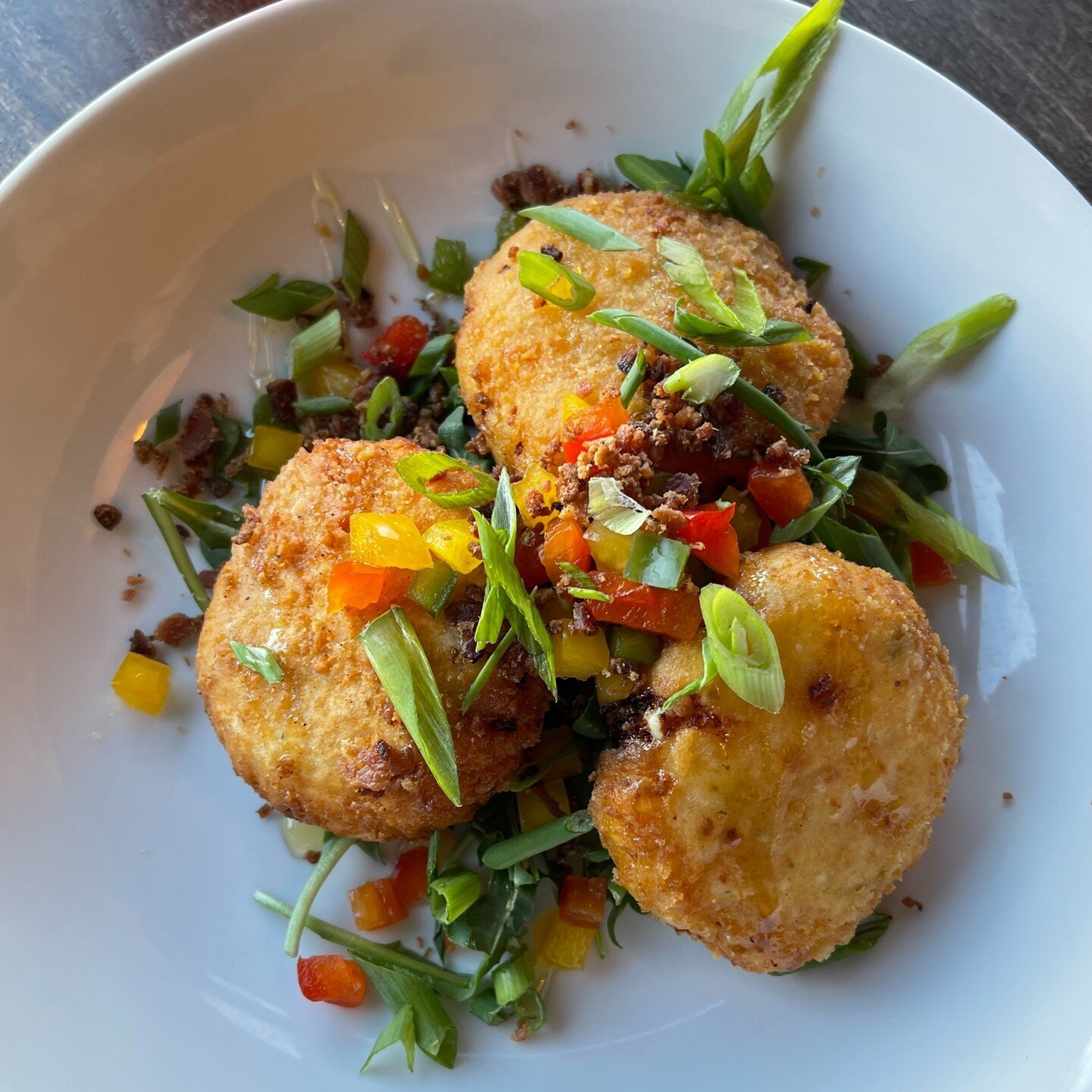 The Goat Cheese Shrimp Cakes are so delicious to start your meal with. Filled with our firecracker shrimp, goat cheese, bell pepper, green onion, bacon crumbles and finished with honey, they're the perfect sweet and savory treat.