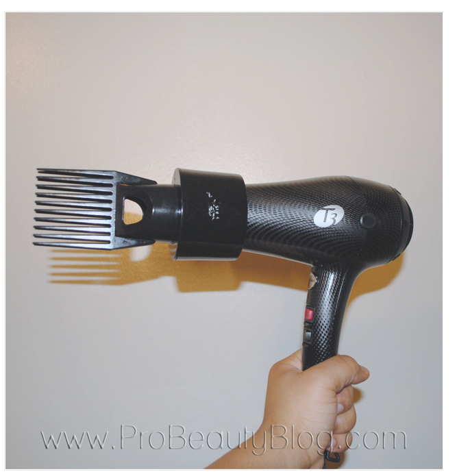 Blow dryer with comb attachment.