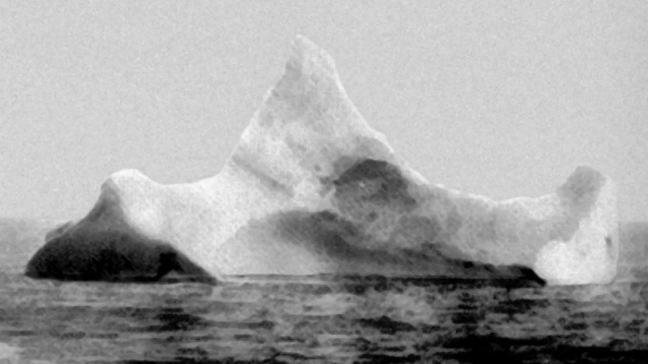 This photo, taken April 15 by the chief steward of German liner SS Prinz Adalbart . Sailing just a few miles away, he hadn't yet known of the Titanic tragedy, but he did observe an iceberg with a red paint streak along the waterline; telltale signs of a very recent collision.