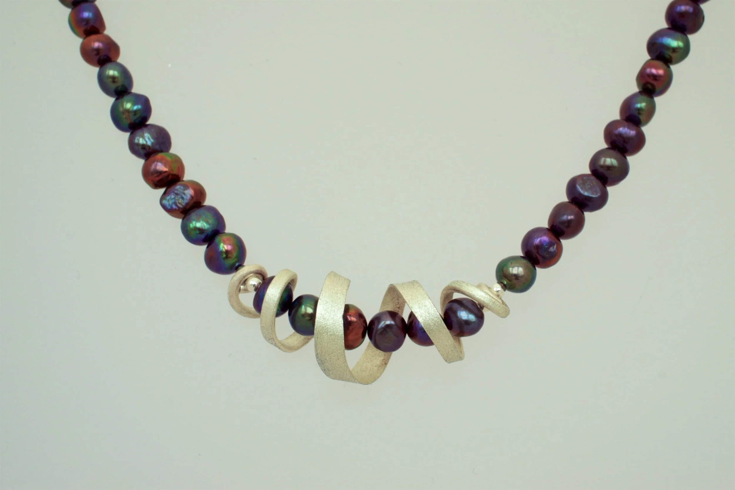 Frosted silver swirl and peacock pearl necklace