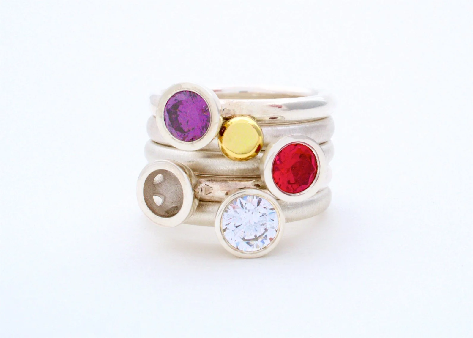 Scattered trillions stacking rings in warm tones