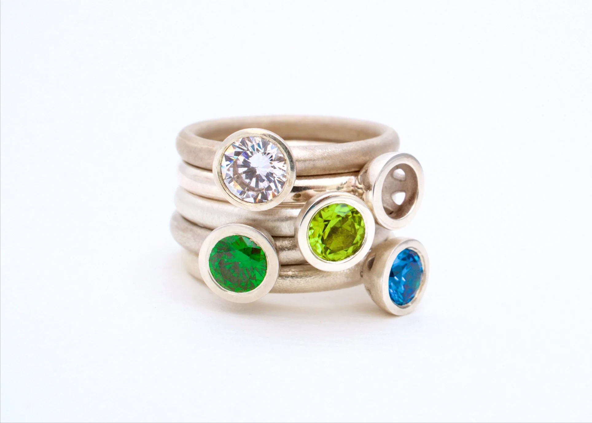Kate Phipps Scattered trillions stacking rings in cool tones.jpg