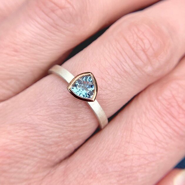Aquamarine, like emerald, is a form of beryl. The name comes from the Latin word for seawater. It&rsquo;s the birthstone for March and looks stunning set in yellow gold, rose gold or silver. Here, I&rsquo;ve set this trillion cut aquamarine in 9 cara