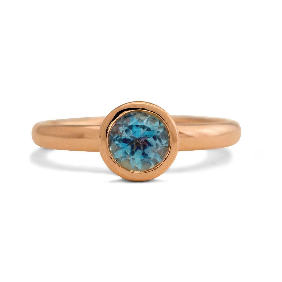 Another aquamarine beauty. This one is a deeper blue than the shades you usually see. Again, this one is set in 9 carat rose gold. The ring has a polished finish all over and has 6 little triangular shaped cut outs around the sides of the setting. 

