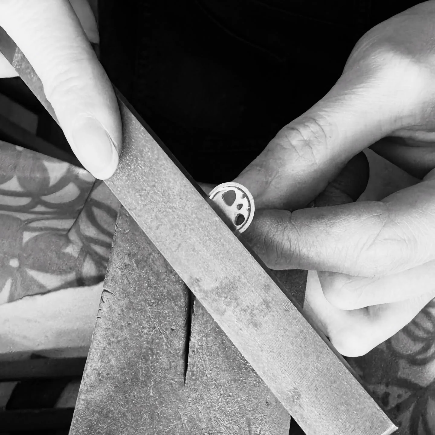A quiet moment at the bench – working on one of my scattered trillions stud earrings. I love how the black and white photo captures the focus and texture of the process.
#handmadejewellery #jewellerymaker #benchwork #silversmith #makersatwork