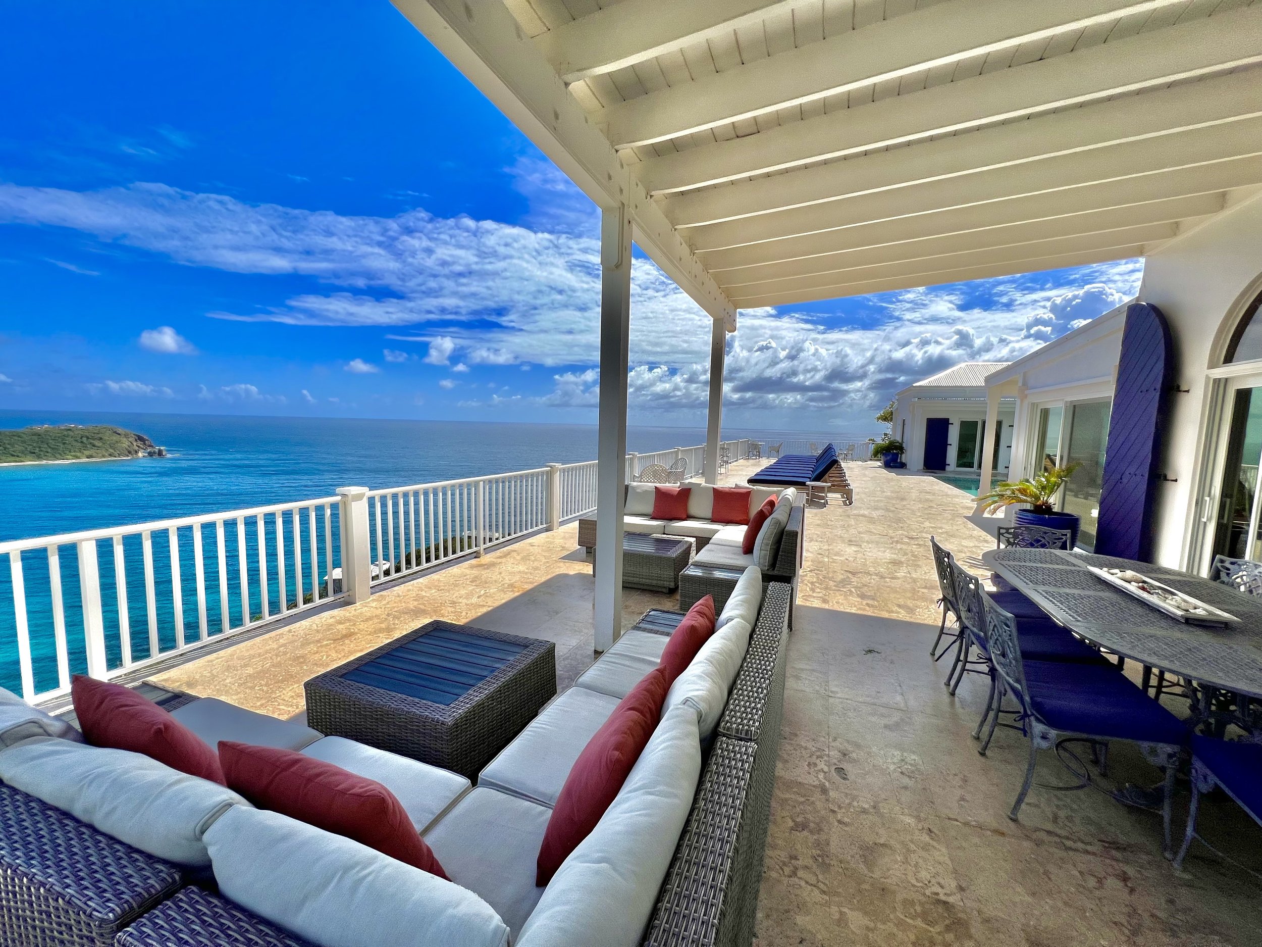 Take in the big blue views from the covered porch are or the loung chairs.jpg