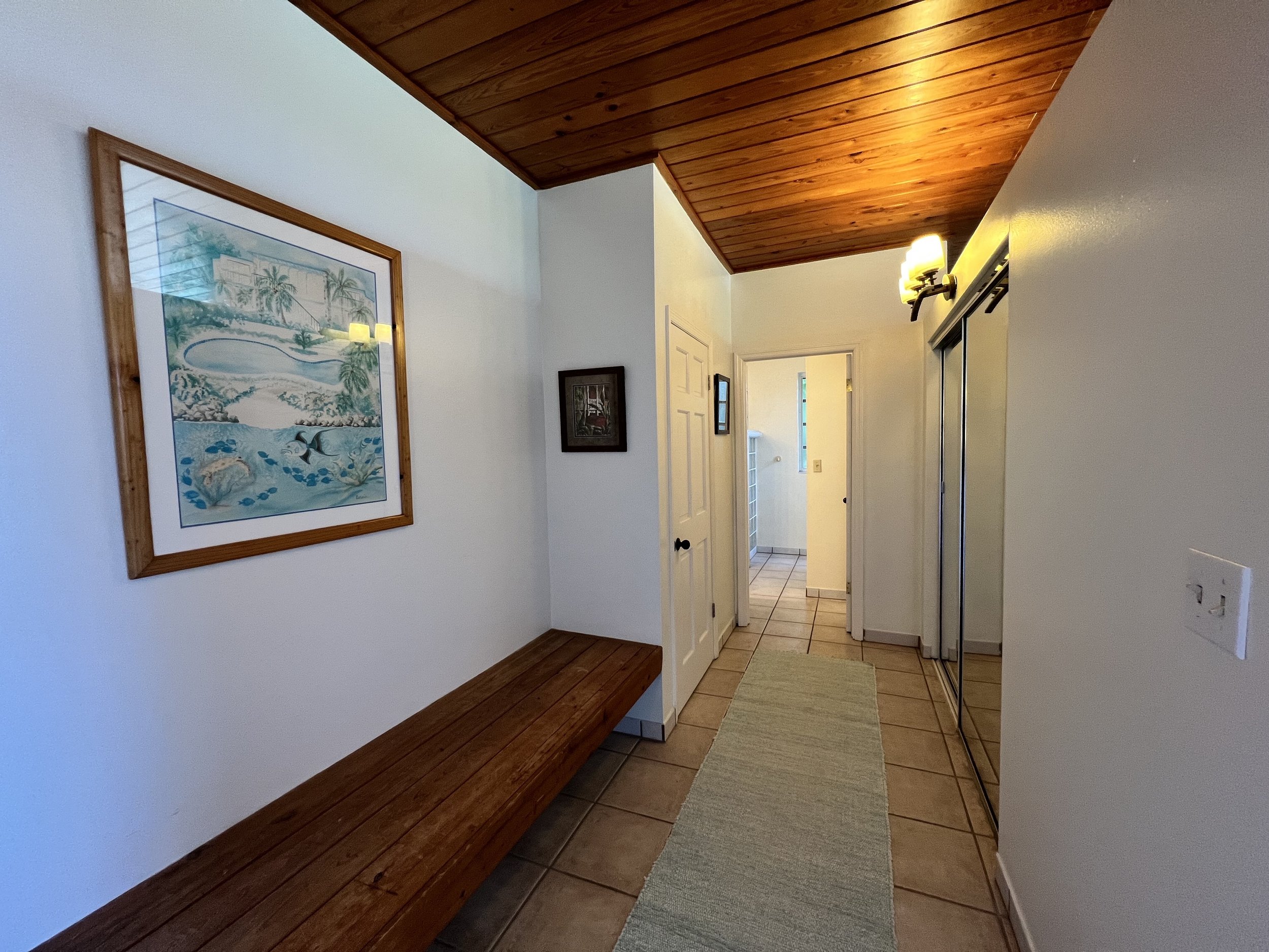 Hallway in each Bedroom with Closet Leading to Bathroom.jpg