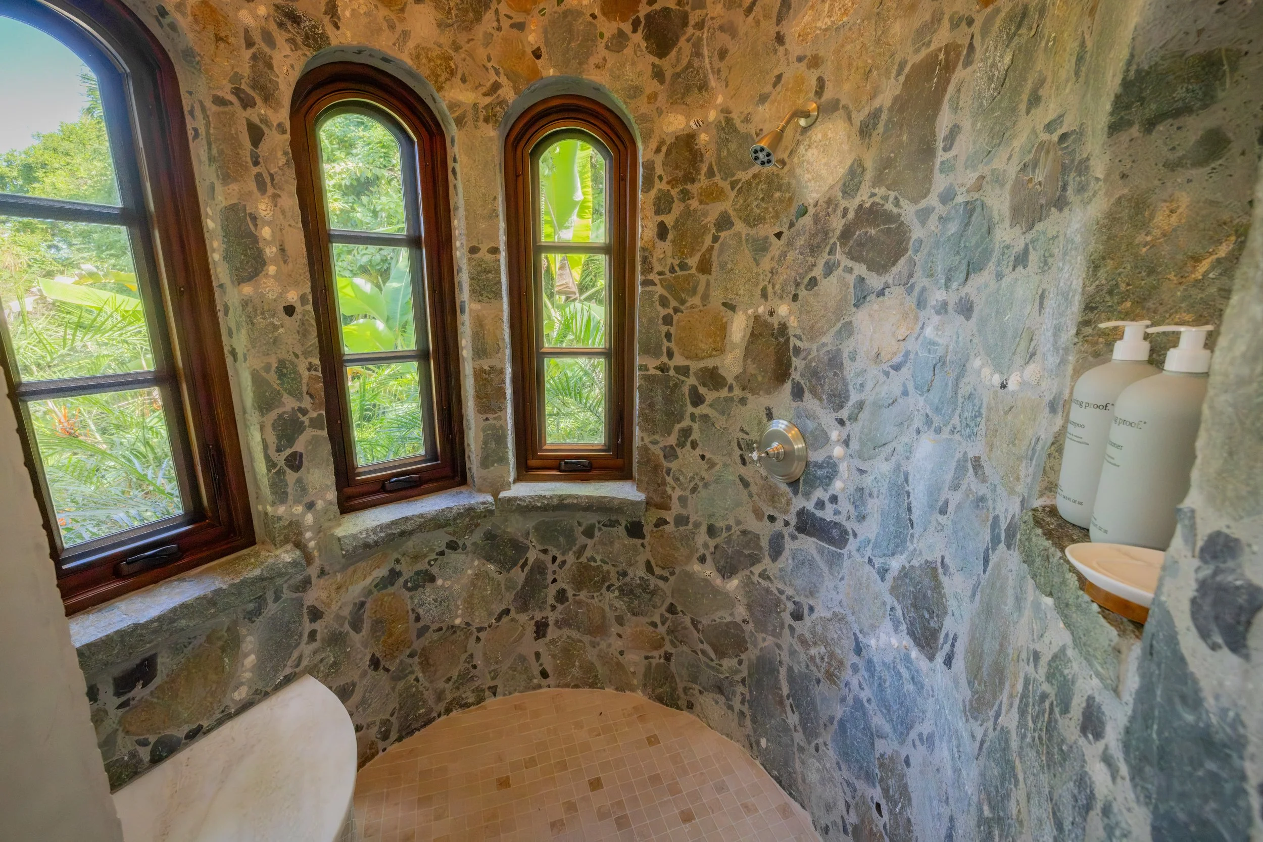 En-suite bathroom with rock shower and views