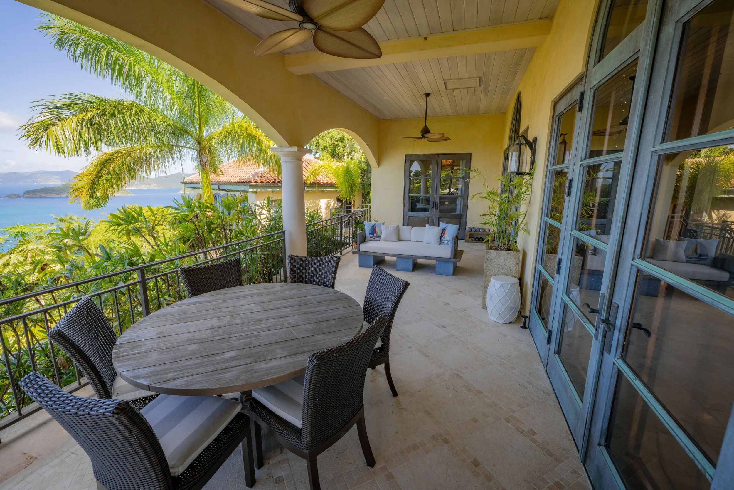 Outdoor patio with dining and a swing