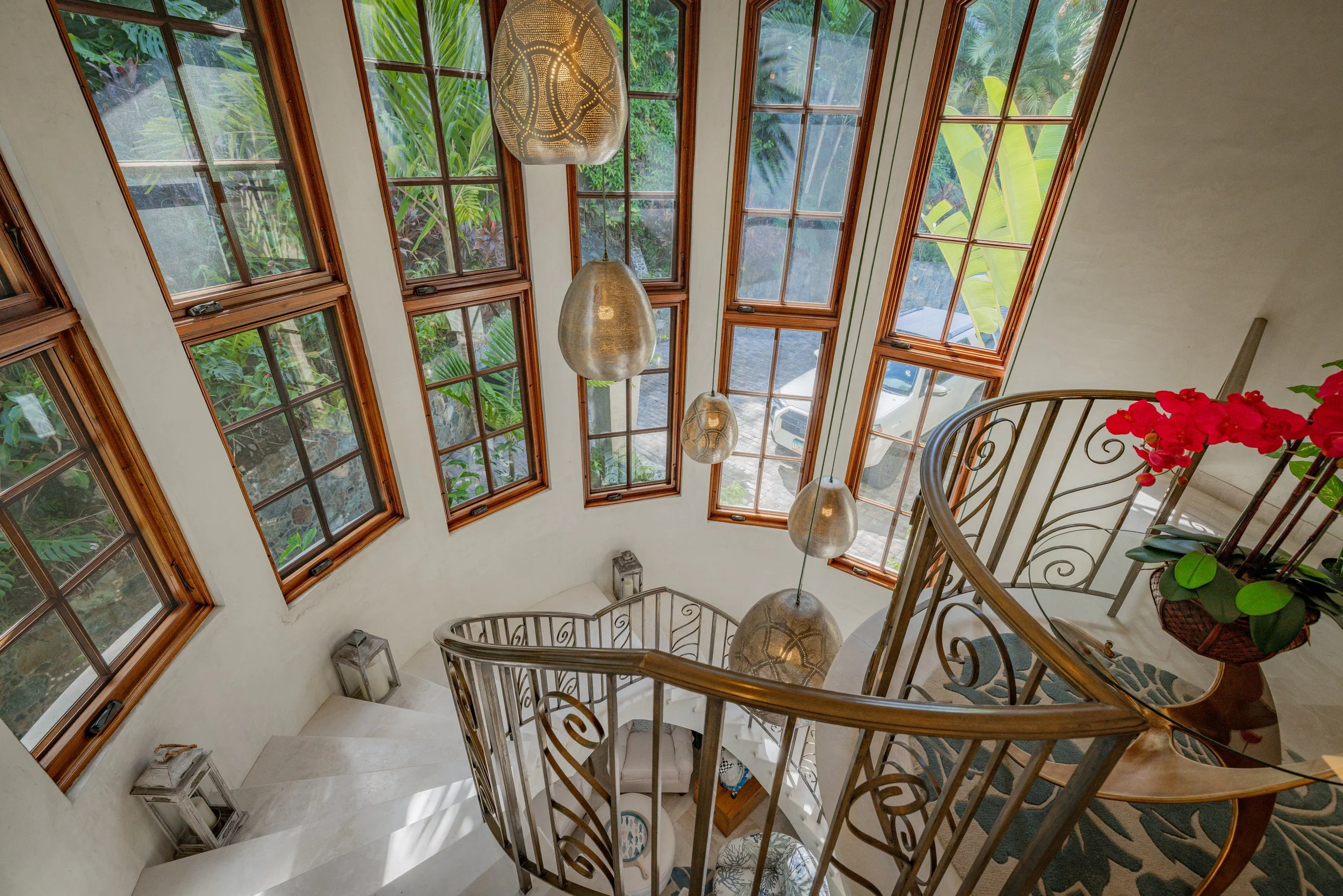 Grand spiral staircase to Primary king suite