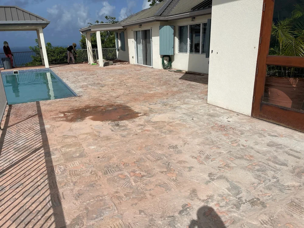 Red tile being removed from the Villa Panache pool terrace