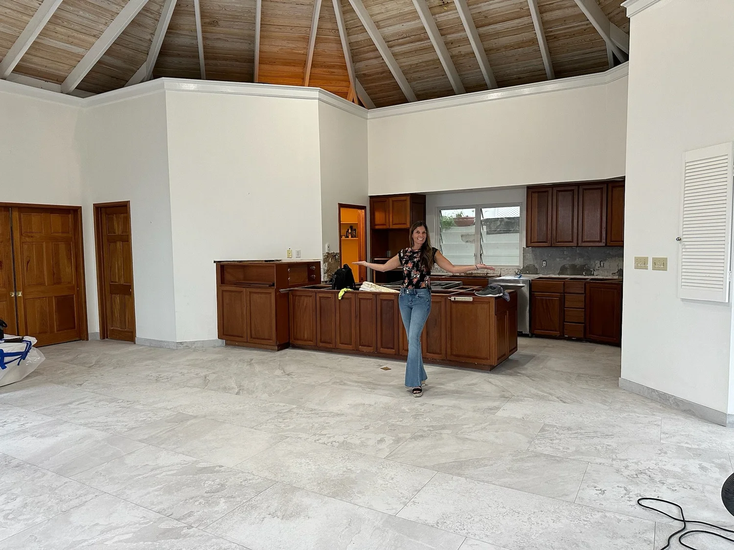 Angie standing in an unfinished villa space