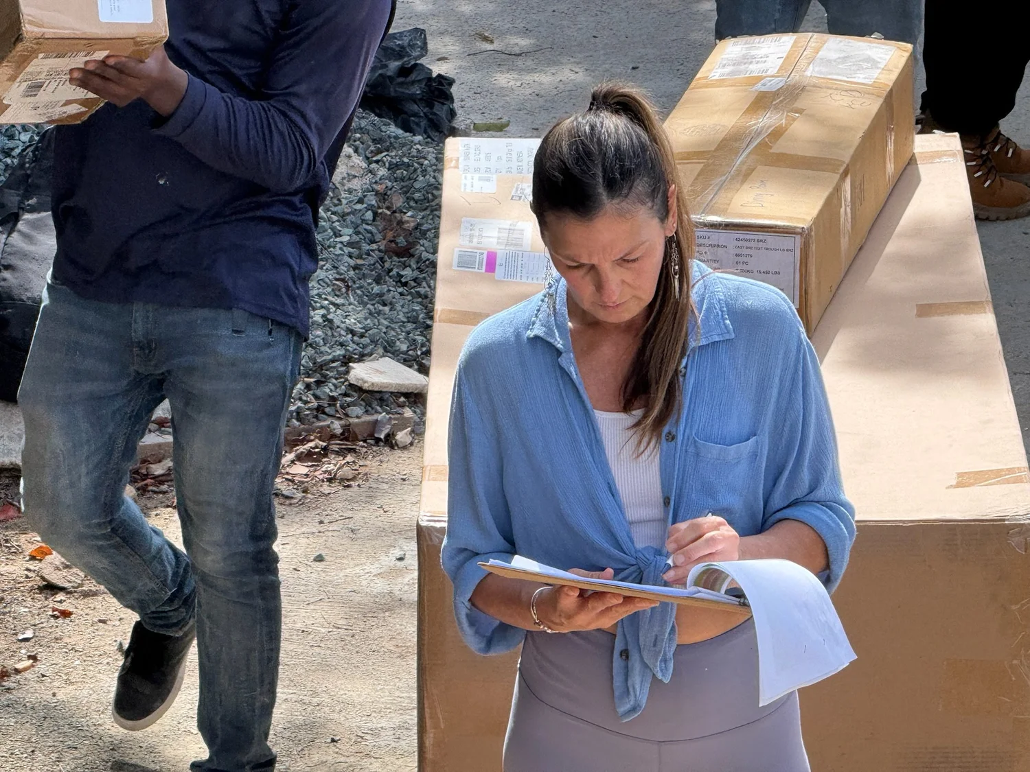 Angie reviewing villa plans on site