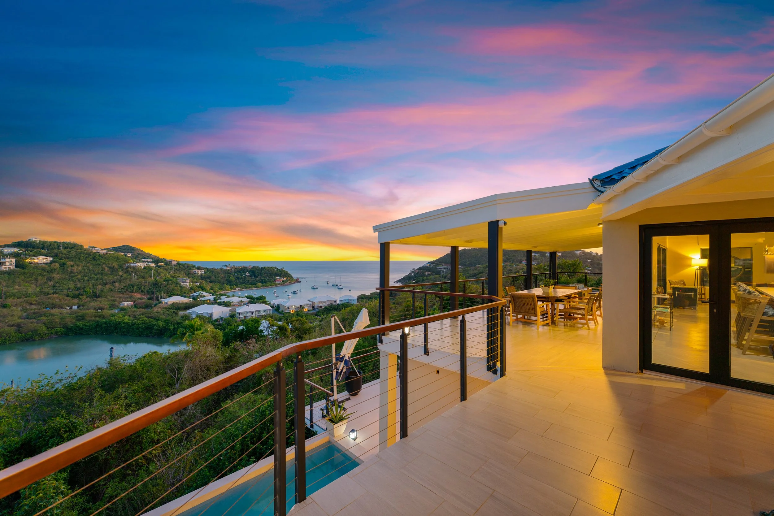 Villa Kia Orana terrace at sunset overlooking Chocolate Hole