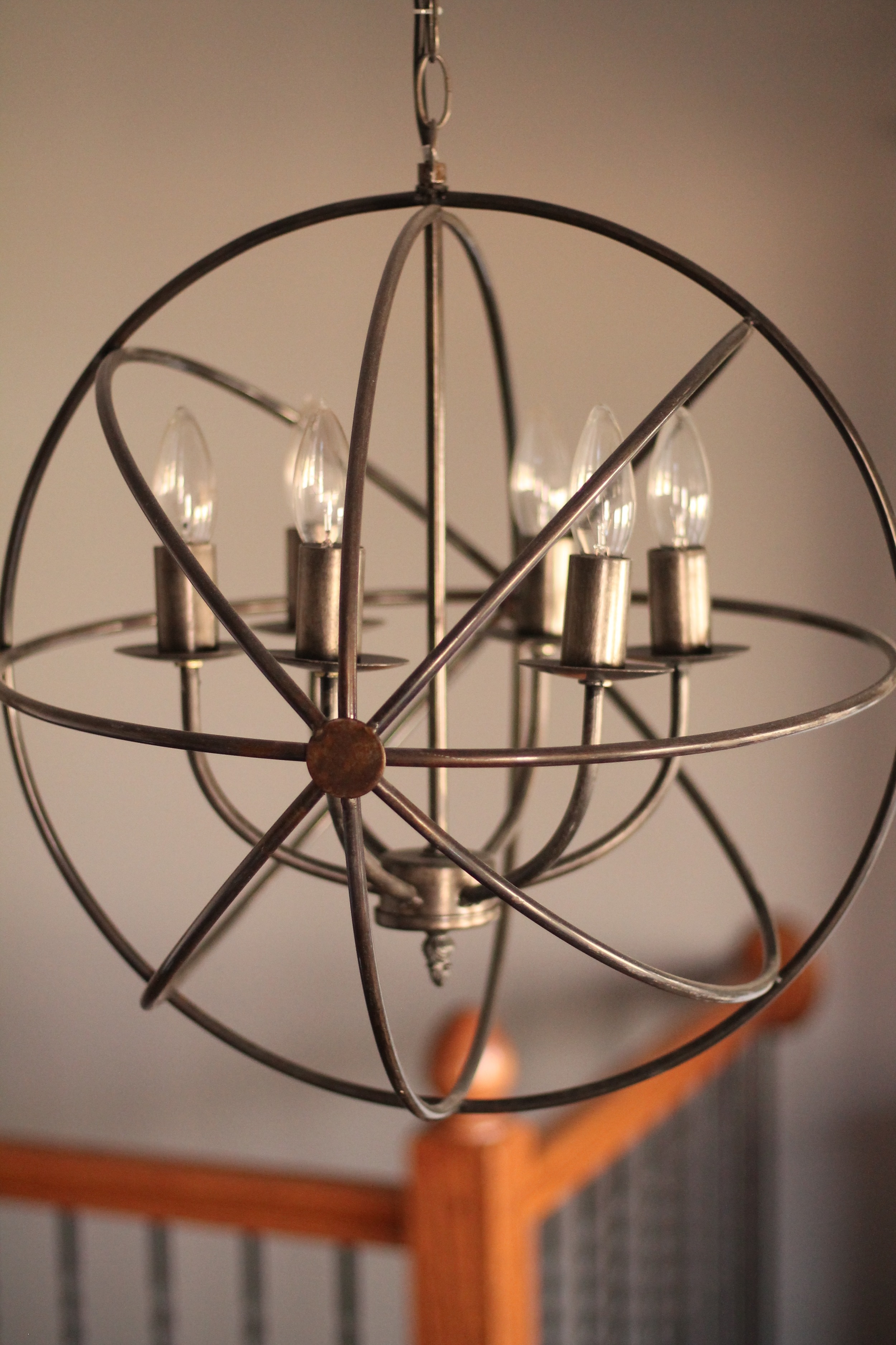 You can find globe chandeliers like this one and many others at RE:. Photo from: Anna Huff