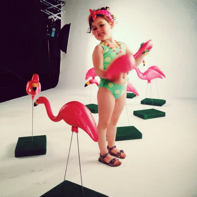 How cute is Miss. Claire in this fabulous chartreuse polka dot swimsuit and her sea of flamingos! I went for a very rockabilly vibe with this one. 