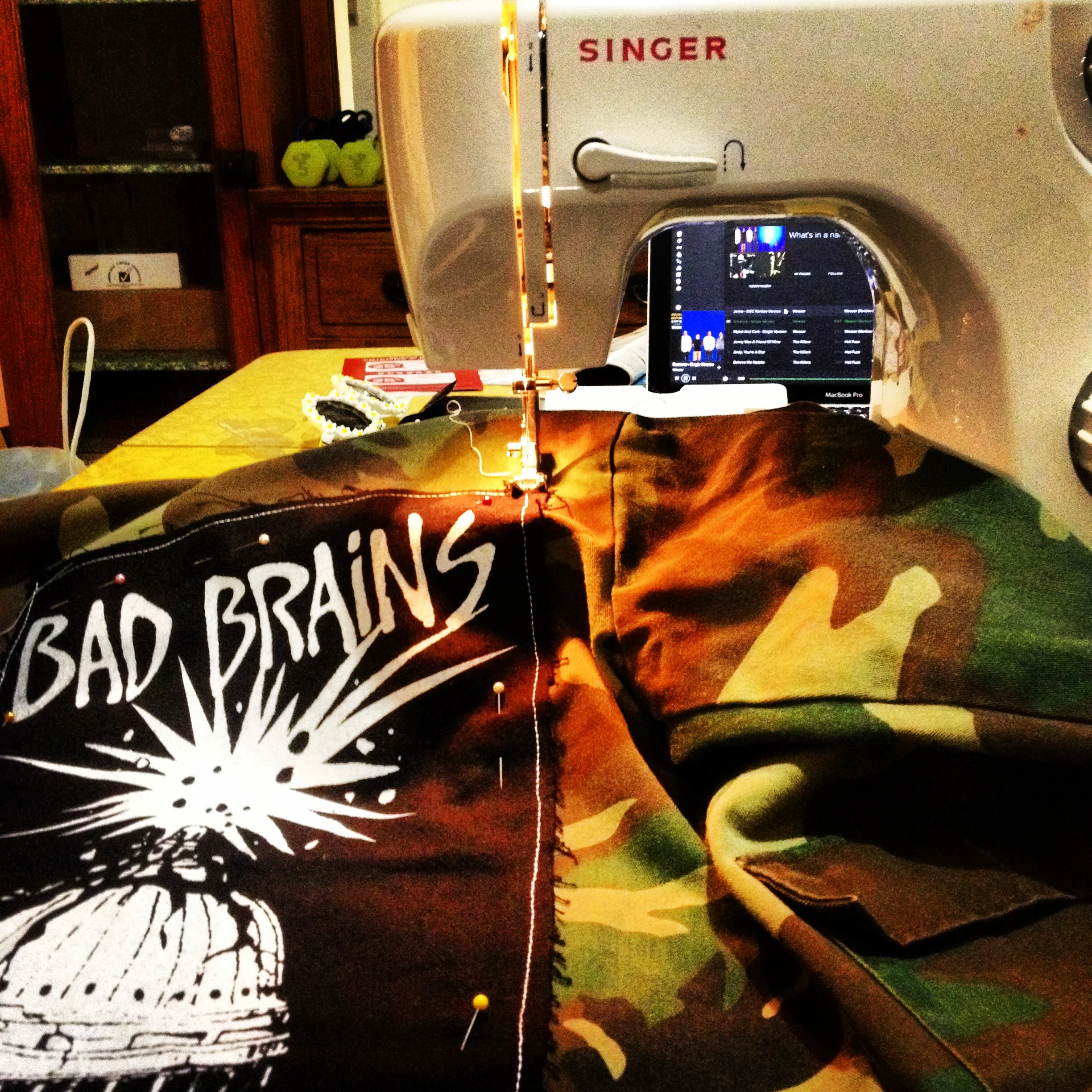 oh, you know, just sewing a killer back patch of only THE BEST BAND EVER on a thrifted vintage camo kiddie jacket to use at the shoot. NO BIG DEAL! 