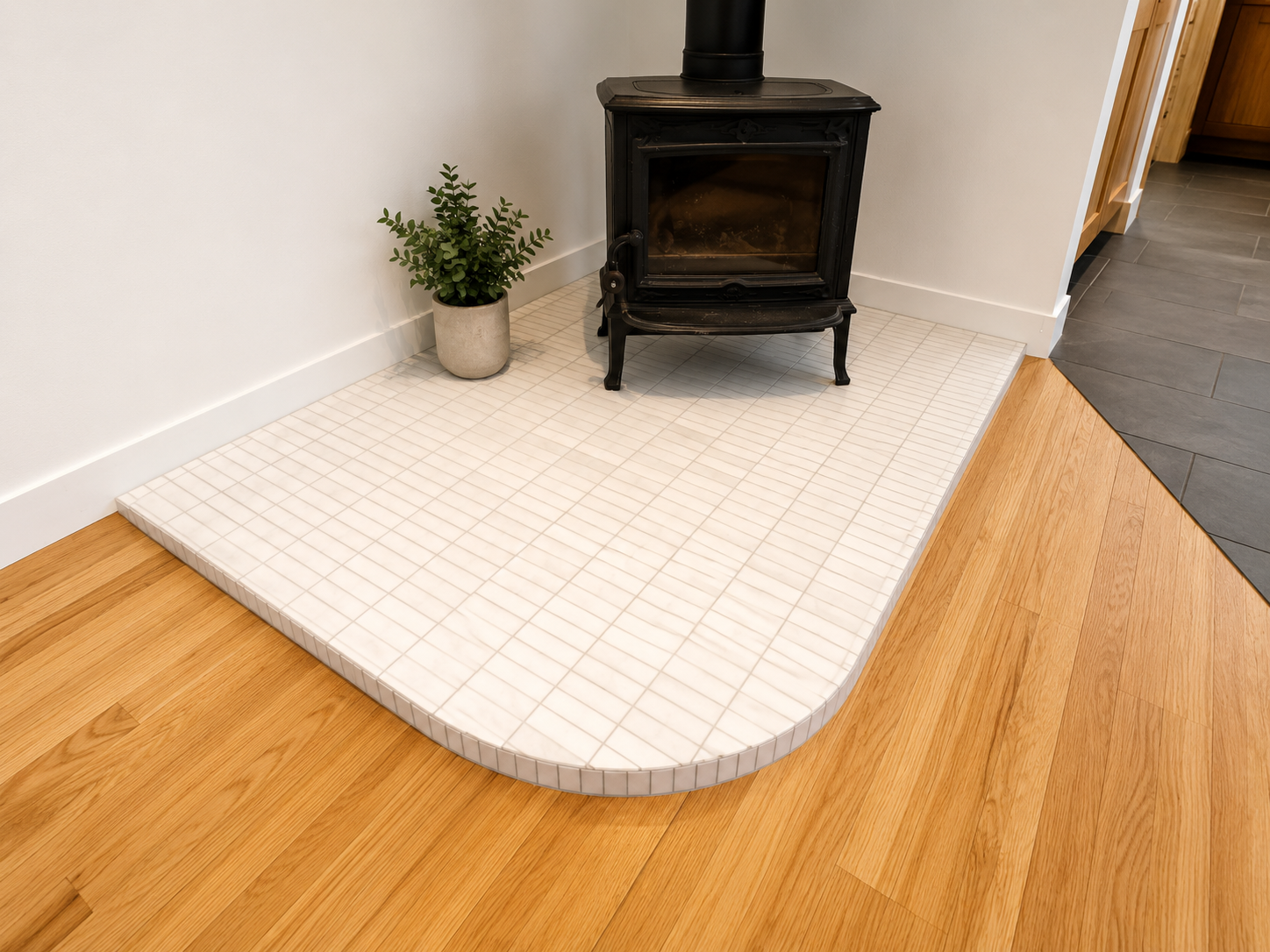 Custom curved tile transition detail in Southeast Portland home renovation