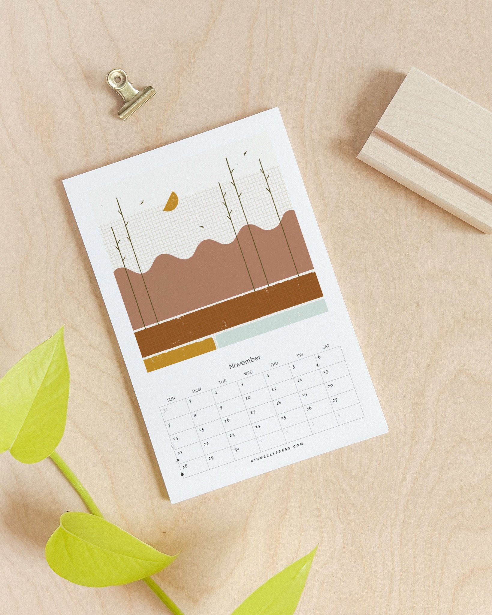 This year&rsquo;s calendar has the option to add on a maple wood stand so your calendar can sit on your desk instead of hanging on the wall. The stands are handmade in Michigan and are so cute with the calendar! 

Save $5 on each calendar you preorde