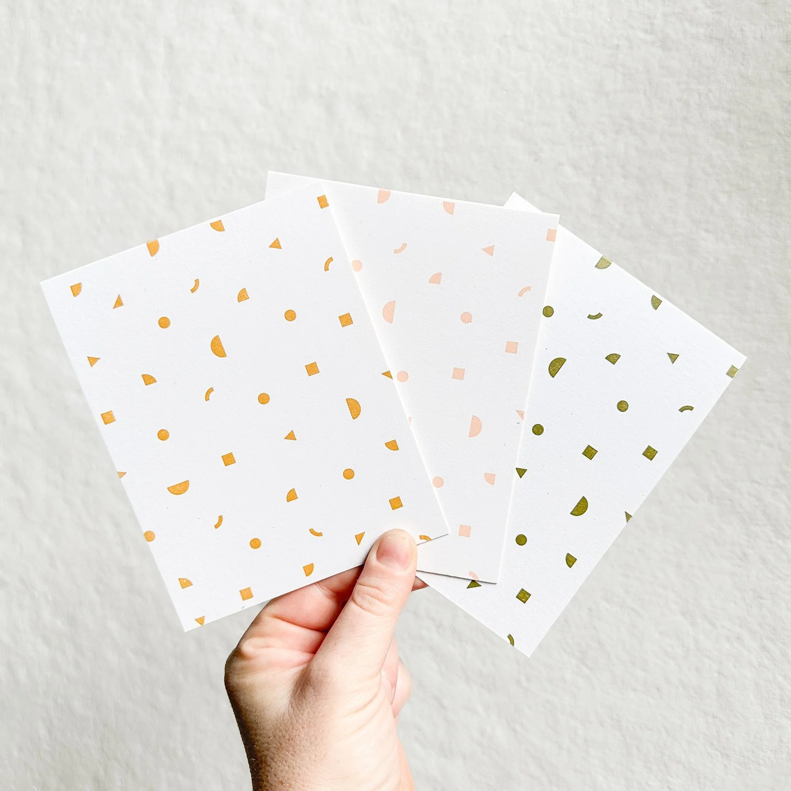 geometric-confetti-cards-color-options-in-hand-square.jpg