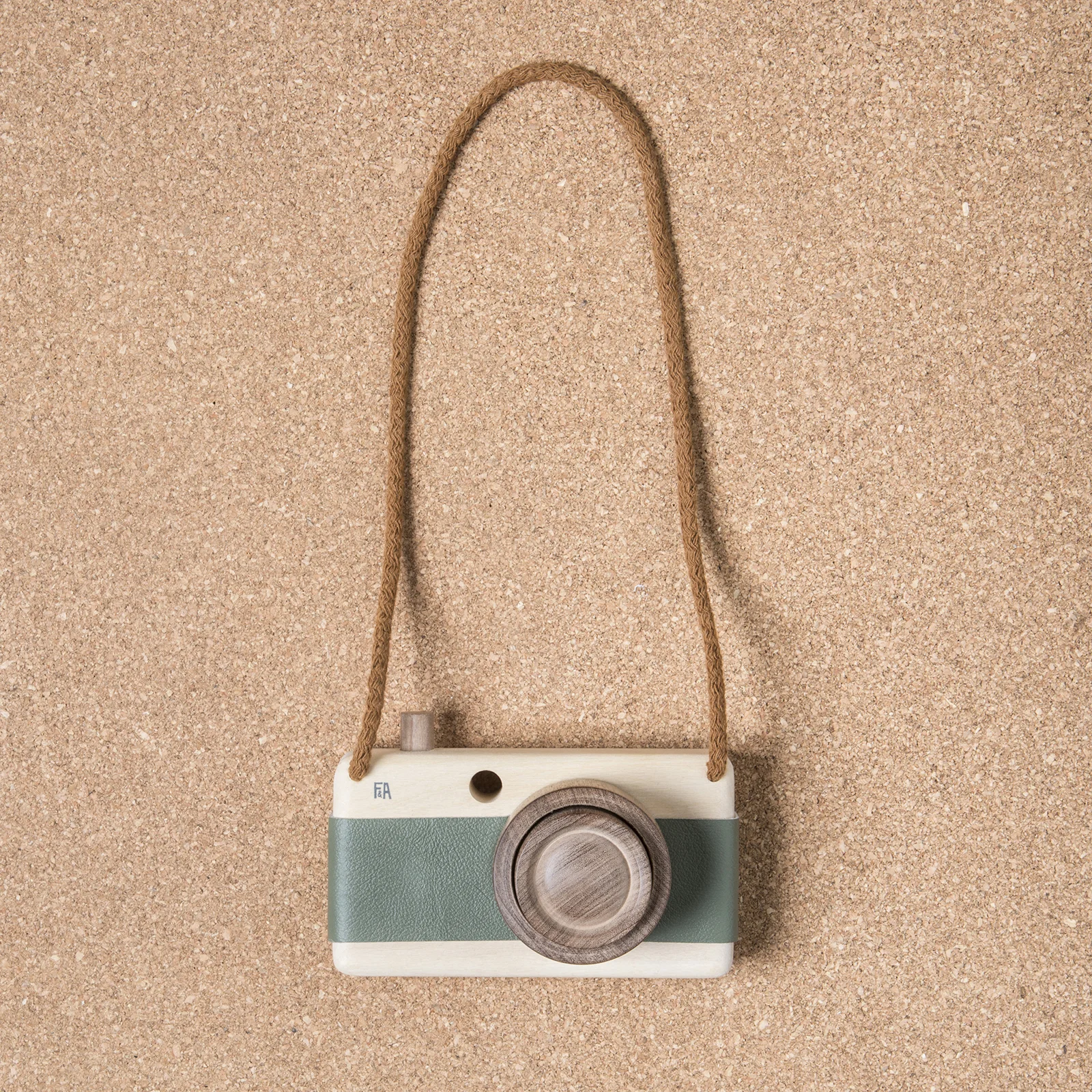 Camera made of Guatambu and Incense wood with leather grip and zoom feature.