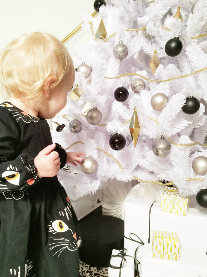 Dress Mini Rodini ( www.pearlsandswines.com ) | Popushop tights ( www.goldfish.be ) |Black Sonatina Booties ( www.kidsandcouture.com )