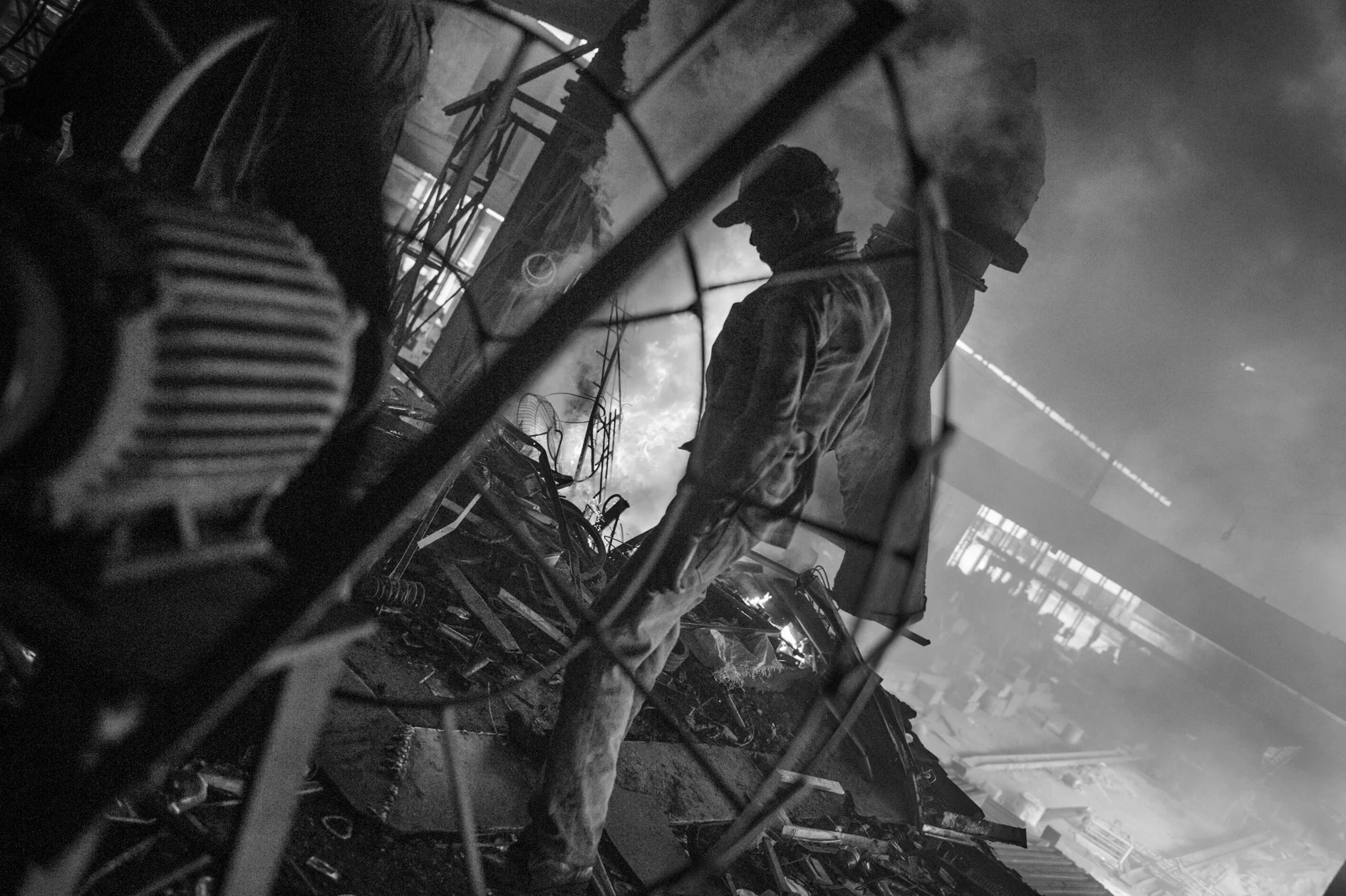 A worker is recycling aluminium in a factory in Shyampur, Dhaka. Most of the workers live around the highly polluted industrial area or in the factories where they work. Transportation to their province of origin is too long and too expensive. June 11th, 2013.