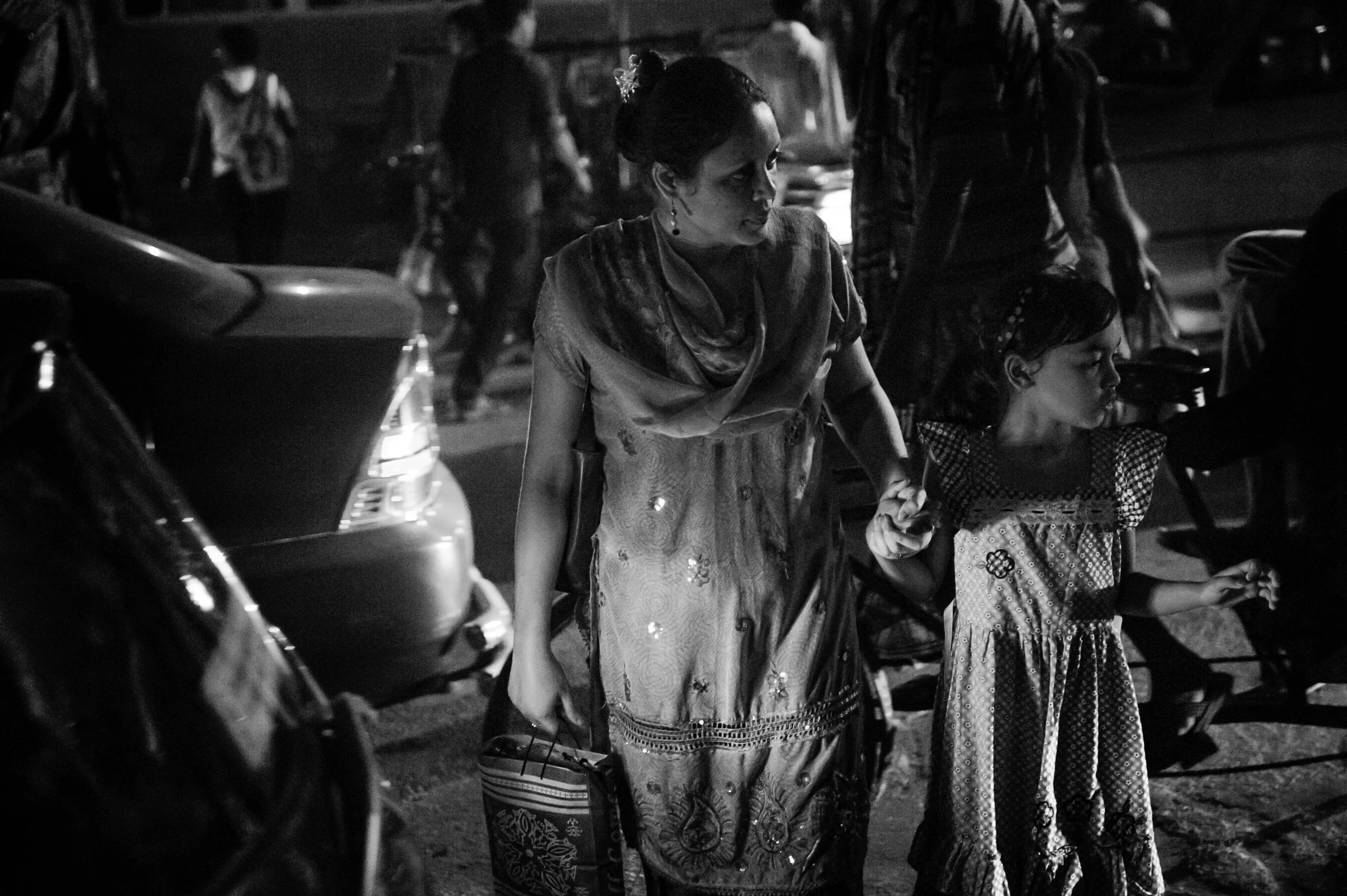 Mother and daughter crossing the street in Motijheel, Dhaka. June 6th, 2013.
