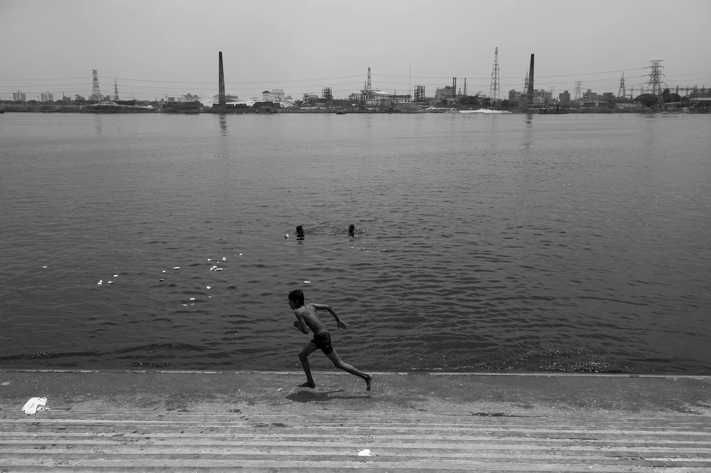 Children take a bath in the Buriganga river, one of the worlds most polluted streams. Sadarghat, Dhake. June 11th, 2013.