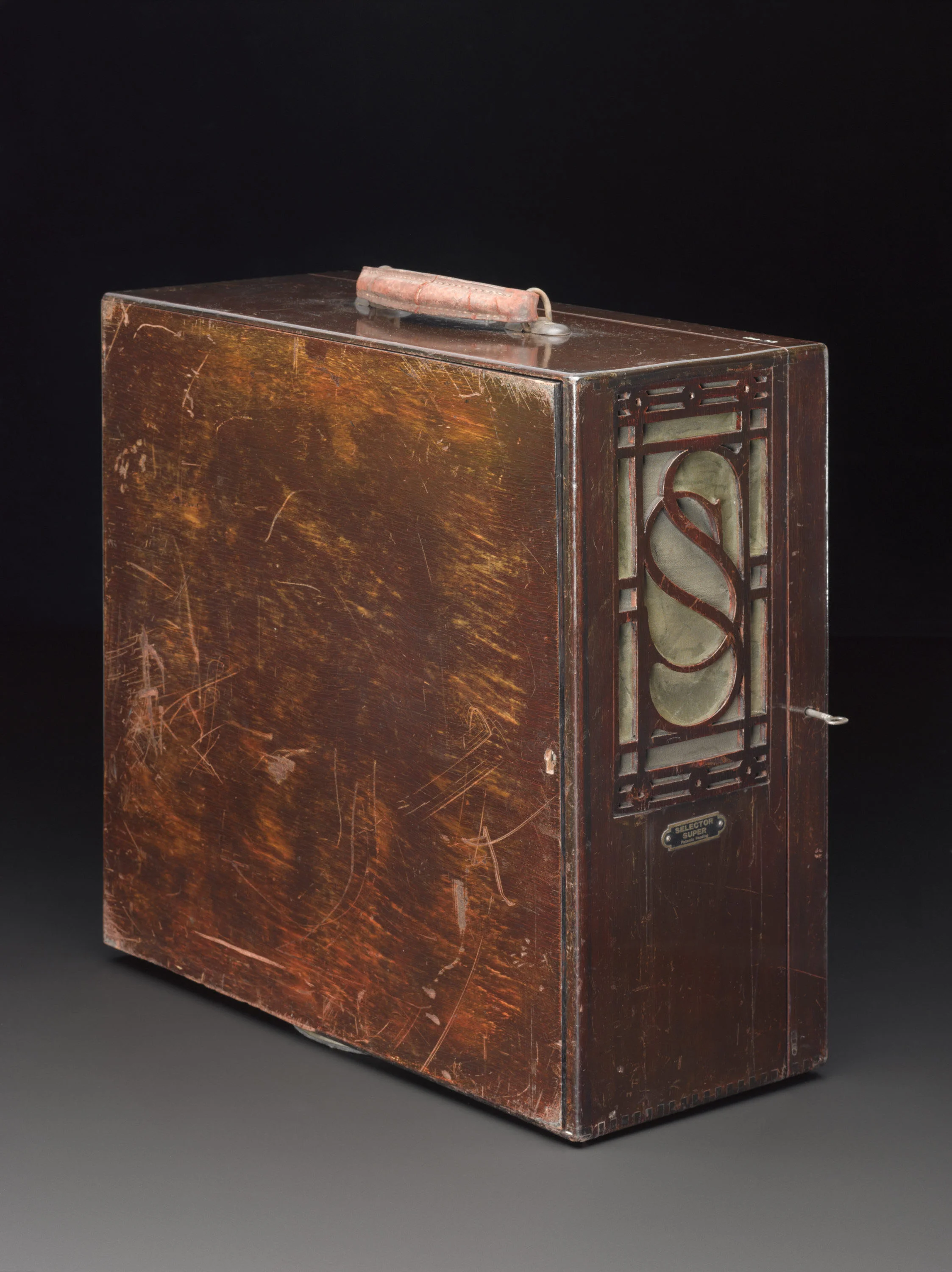 The portable radio is very heavy compared to today’s pocket electronics. Perhaps that explains the rather well worn back of the object. (Source: Science Museum / SSPL)