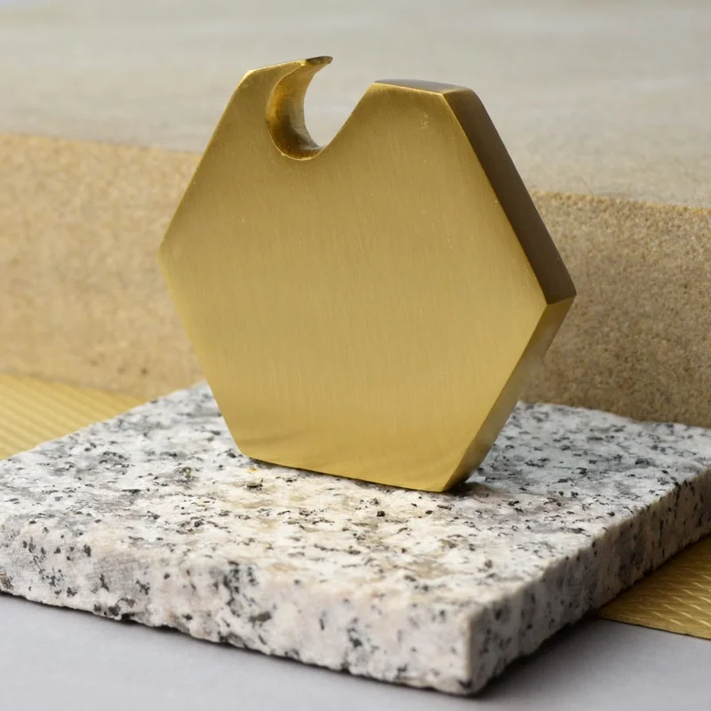 Brass bottle opener, £28 The essential tool with a sleek, geometric twist. In collaboration with Danish brand Ferm Living.