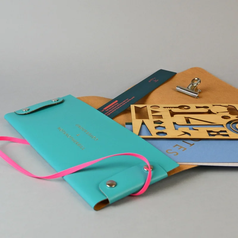 Leather document folder, £25 "A document wallet to give you 10/10 in the board room." Made from recycled leather, in collaboration with Undercover.