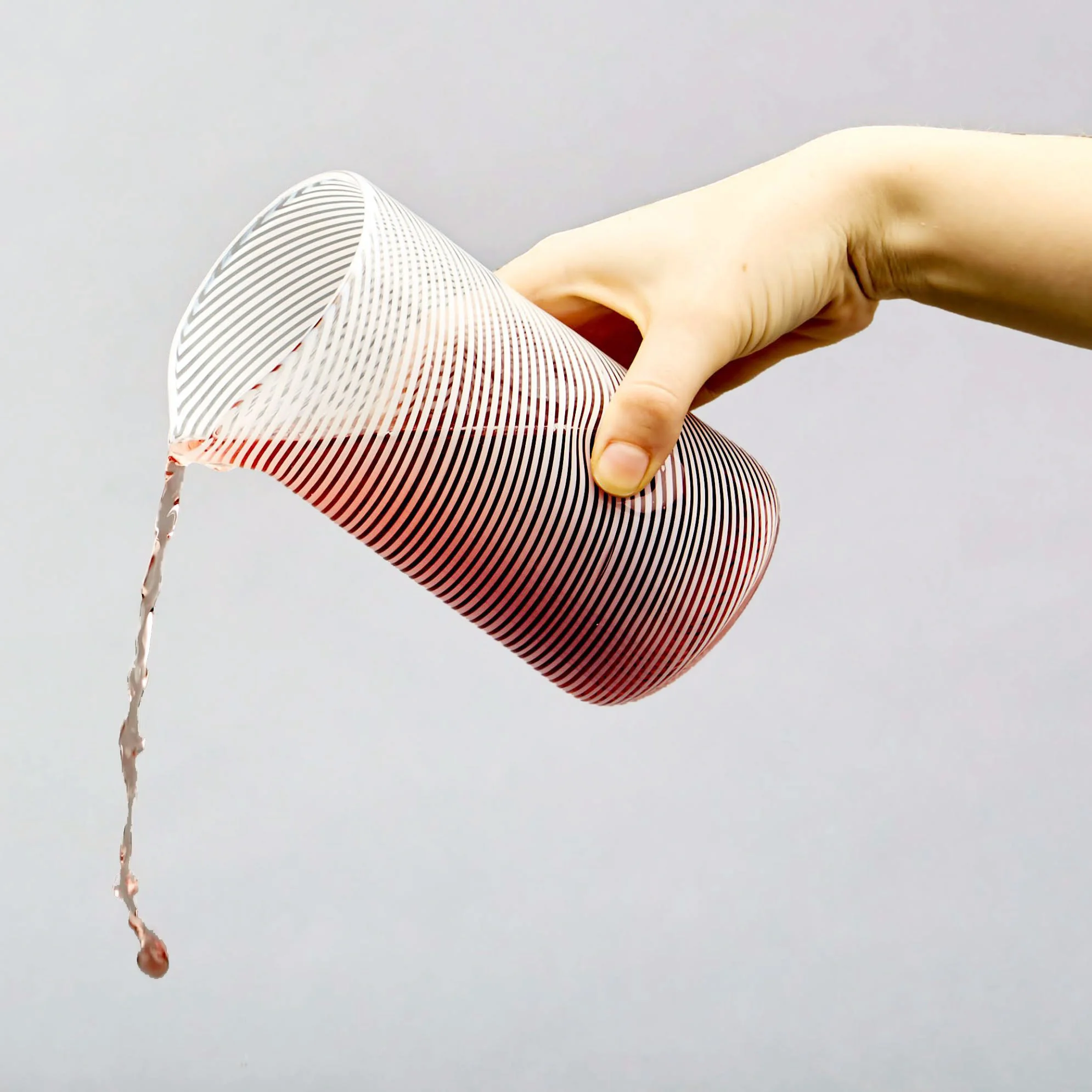 BTU Studio Glass Cylinder A hand-blown glass cylinder threaded with white glass strands. £50