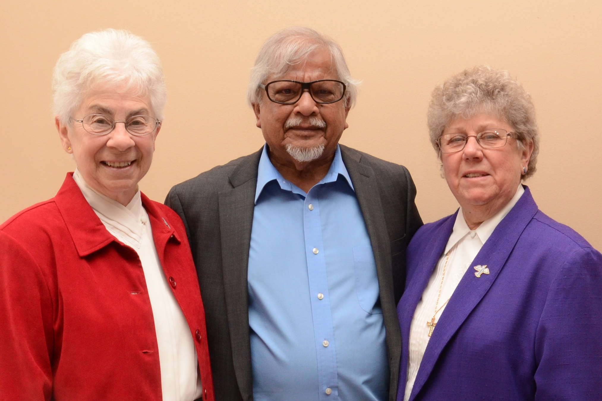 Sisters Mary Jo Colucci, SSJ and Michele Beiter, SSJ with Arun Gandhi