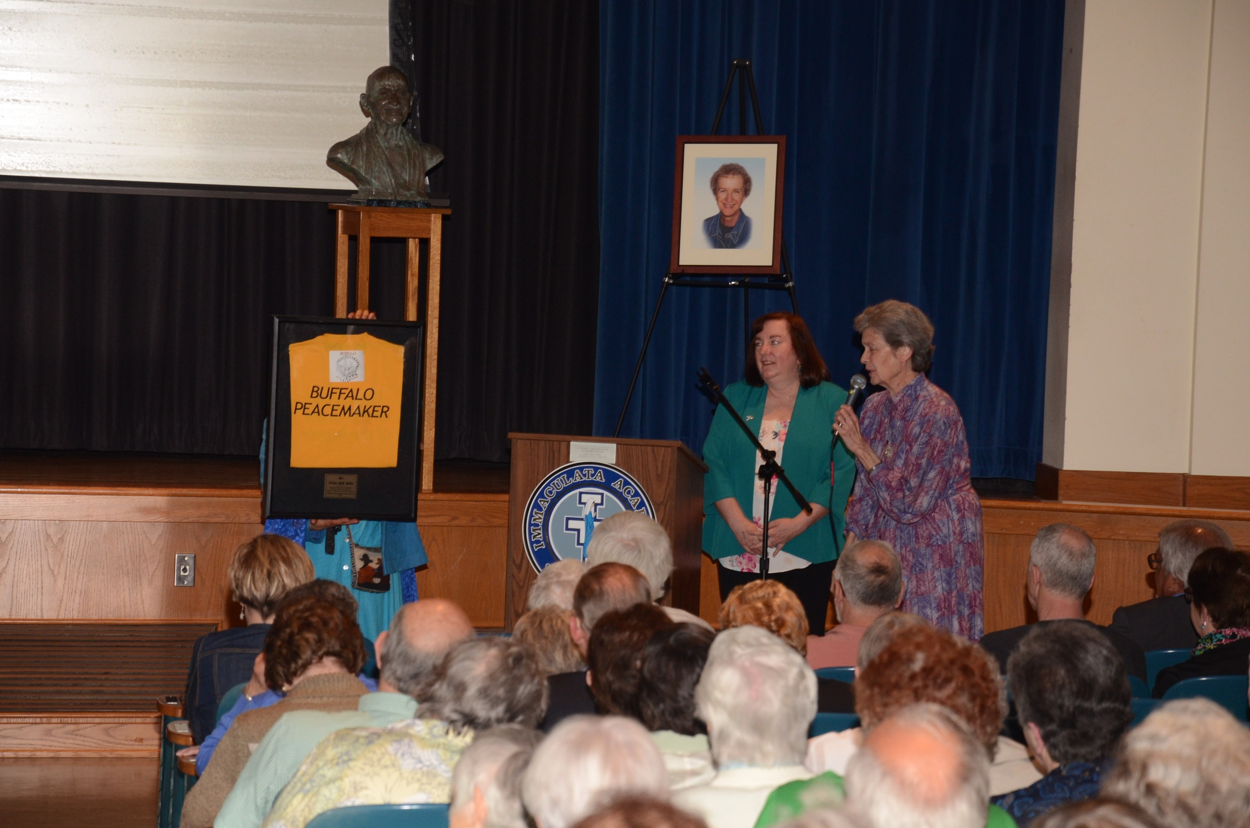 Sister Liz Savage, SSJ recognizes Peacemakers award given to Sister Karen Center Director Vivian Waltz