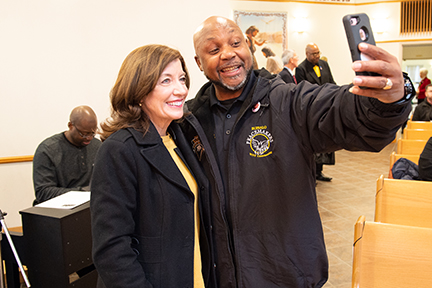 Peacemaker Lenny Lane poses with Kathy Hochul