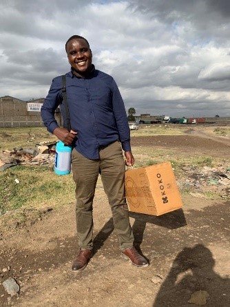 A new KOKO Fuel customer heading home with his new KOKO Cooker &amp; reusable canister