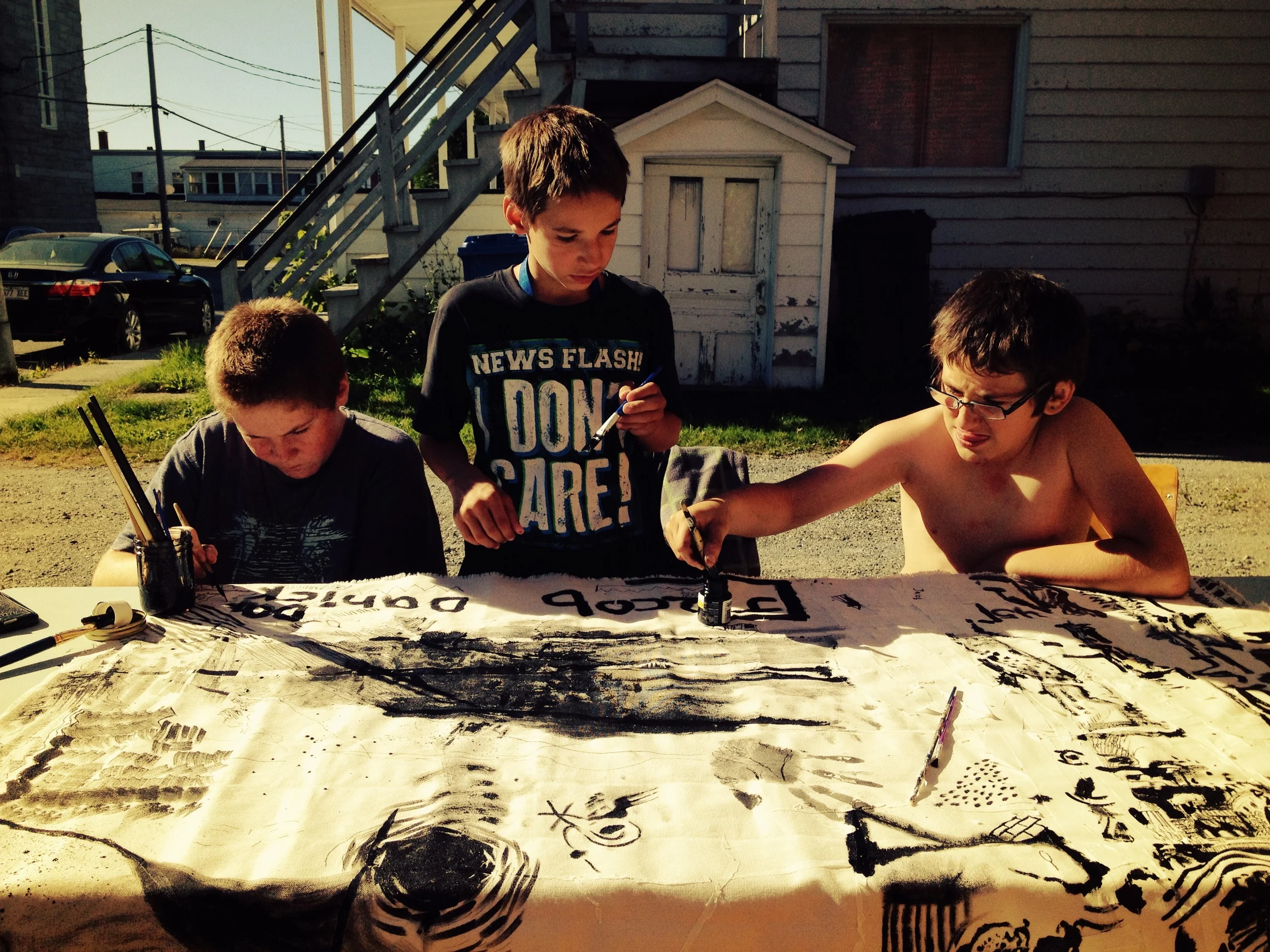 Three kids painting