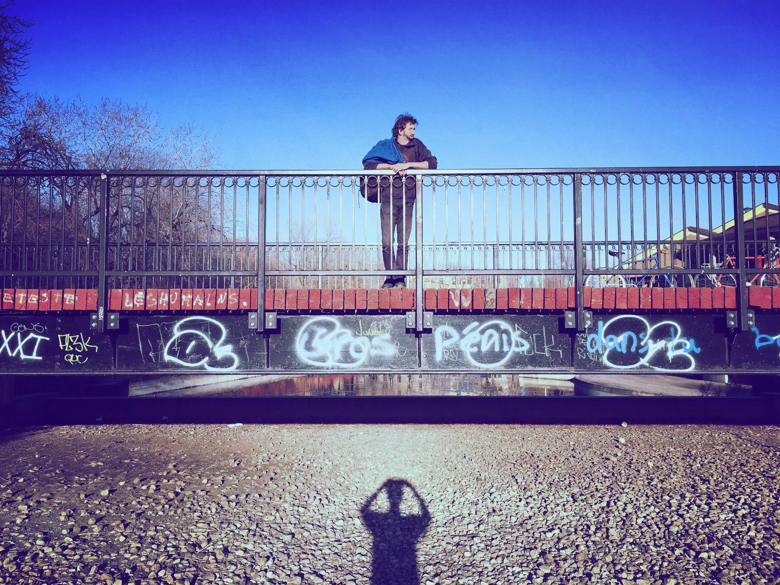 Man on a bridge and my shadow.