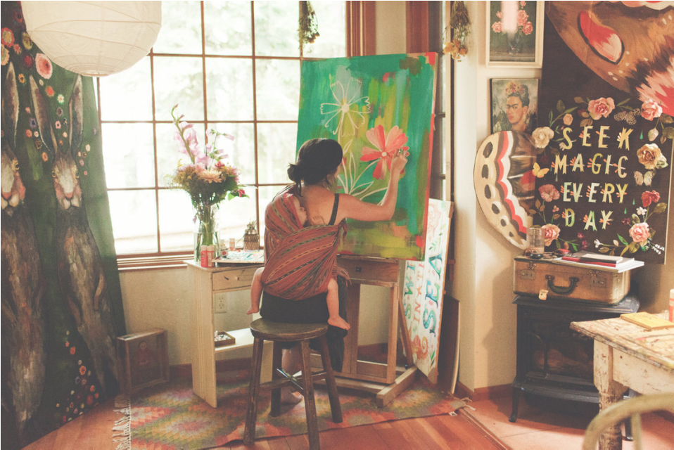 Katie in her studio with her son, Finn